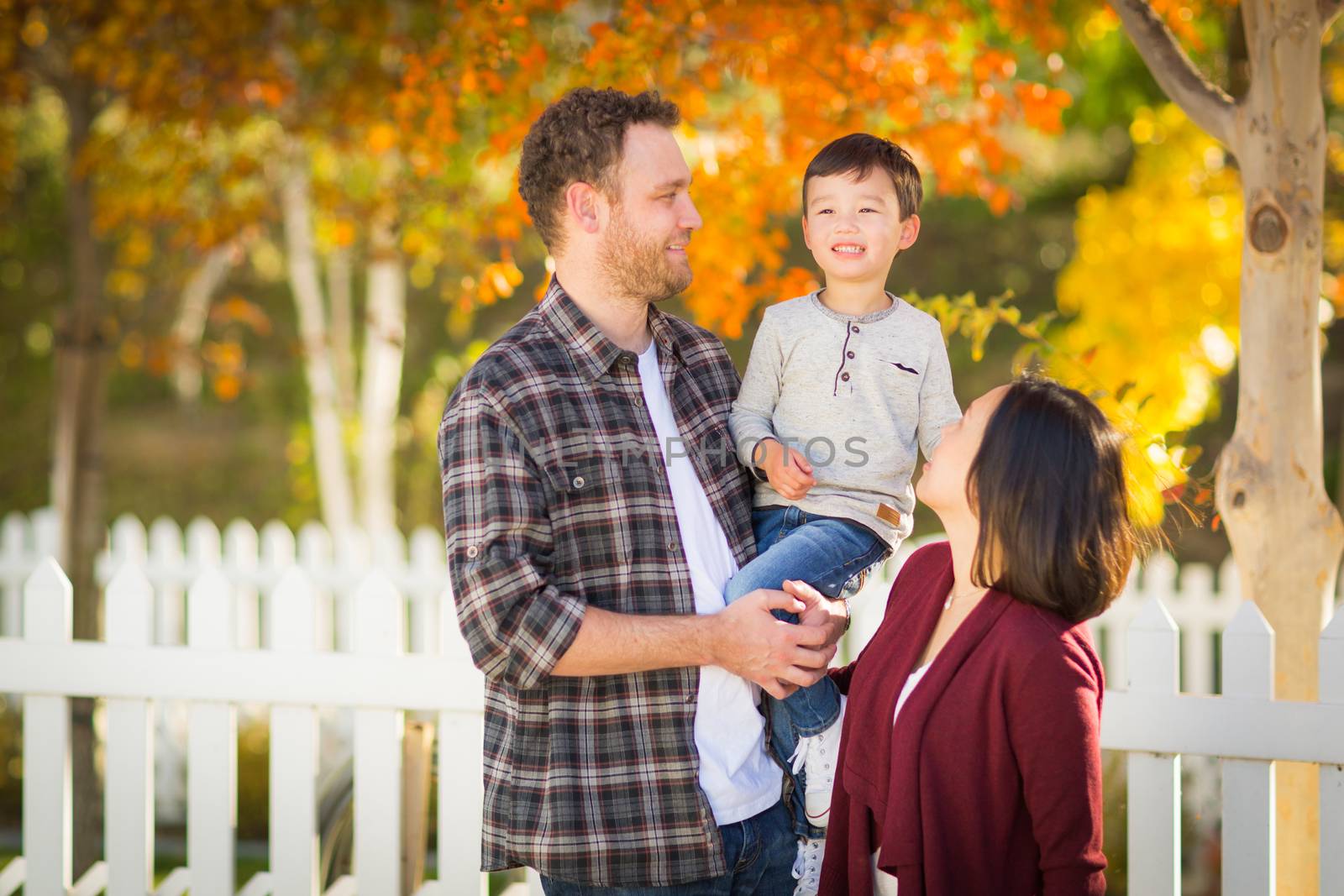 Outdoor Portrait of Mixed Race Chinese and Caucasian Parents and Child. by Feverpitched