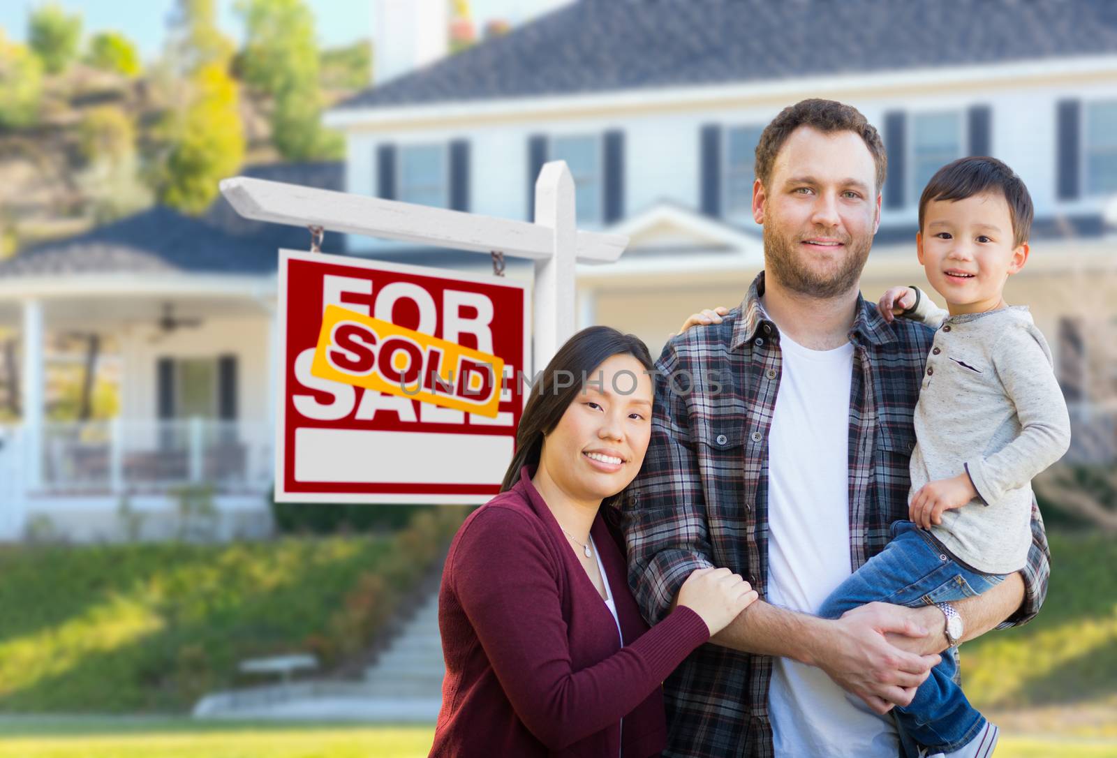 Mixed Race Chinese and Caucasian Parents and Child In Front of House and Sold For Sale Real Estate Sign. by Feverpitched