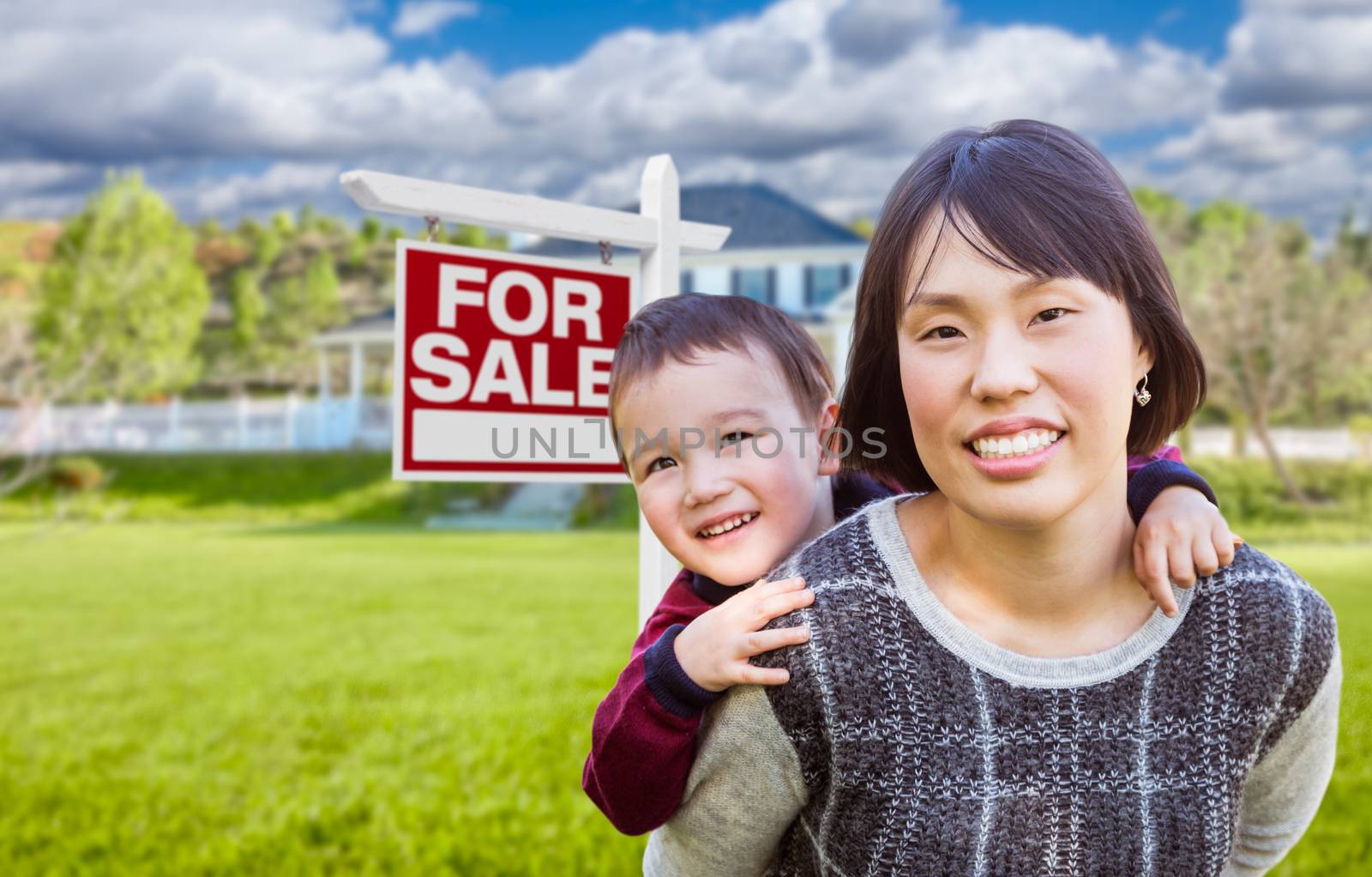 Chinese Mother and Mixed Race Child In Front of Custom House and For Sale Real Estate Sign. by Feverpitched