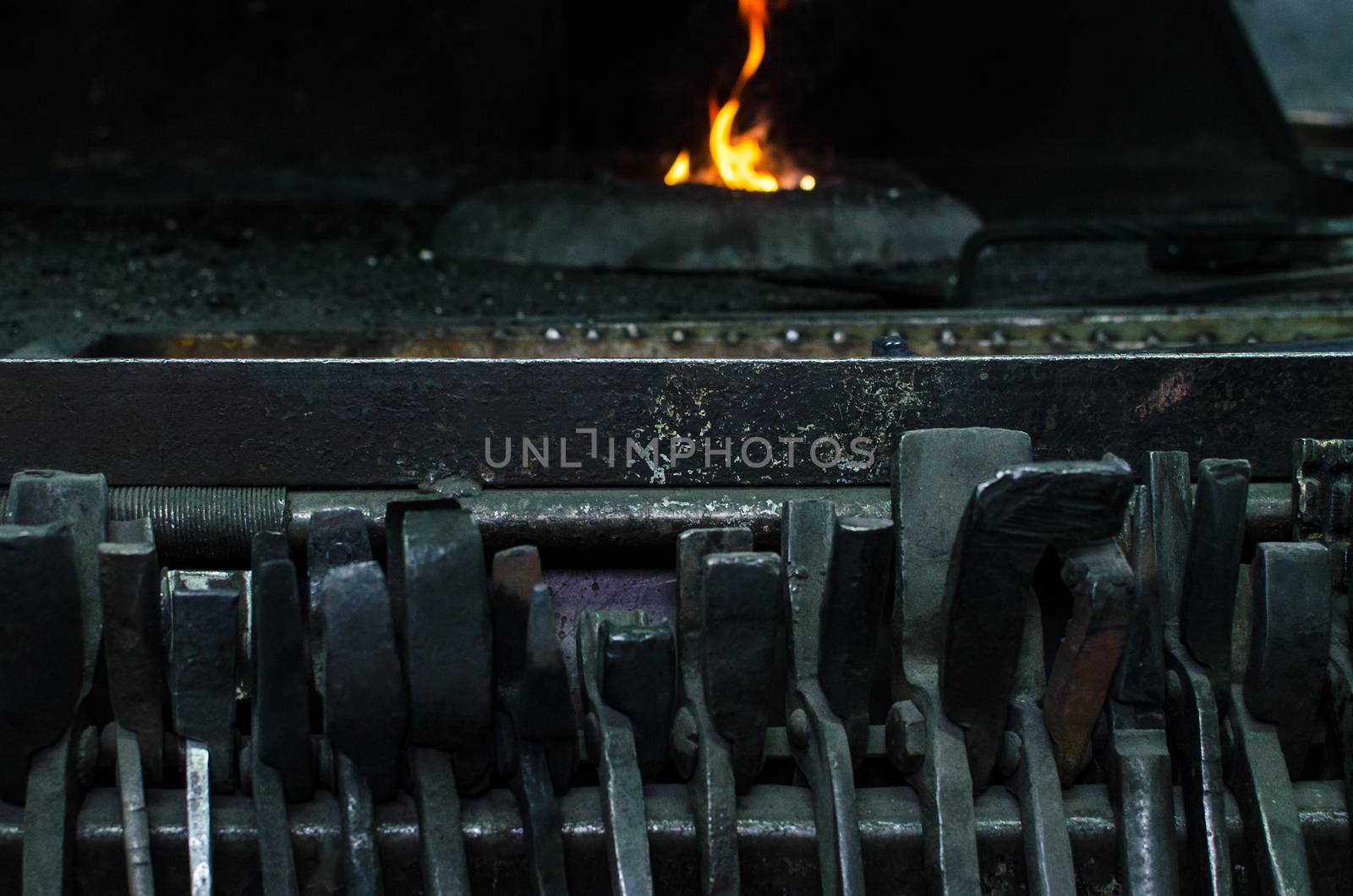 Blacksmith at work, hit with a hammer by a hot metal on the anvil.