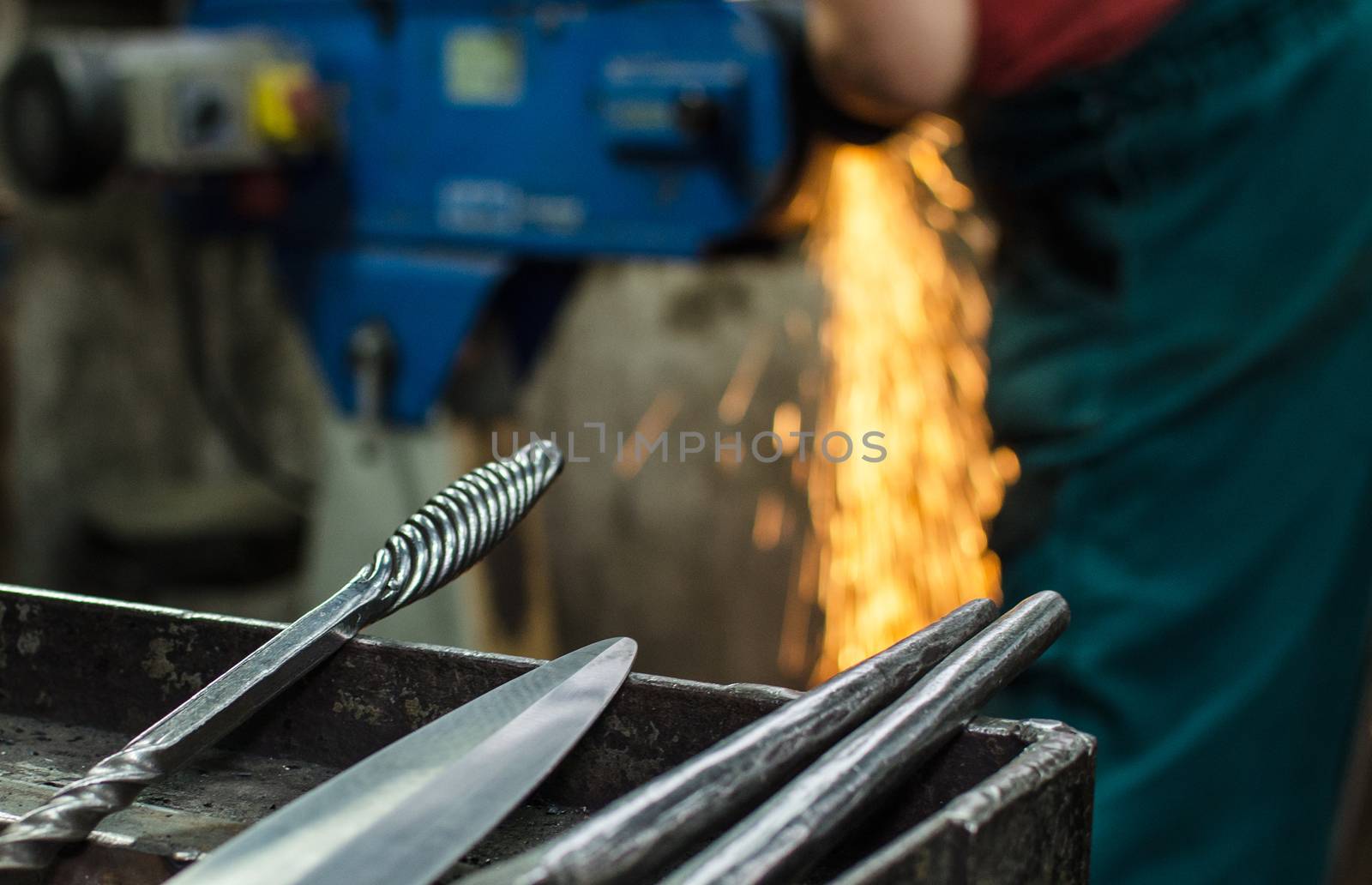 Blacksmith at work, hit with a hammer by a hot metal on the anvil.