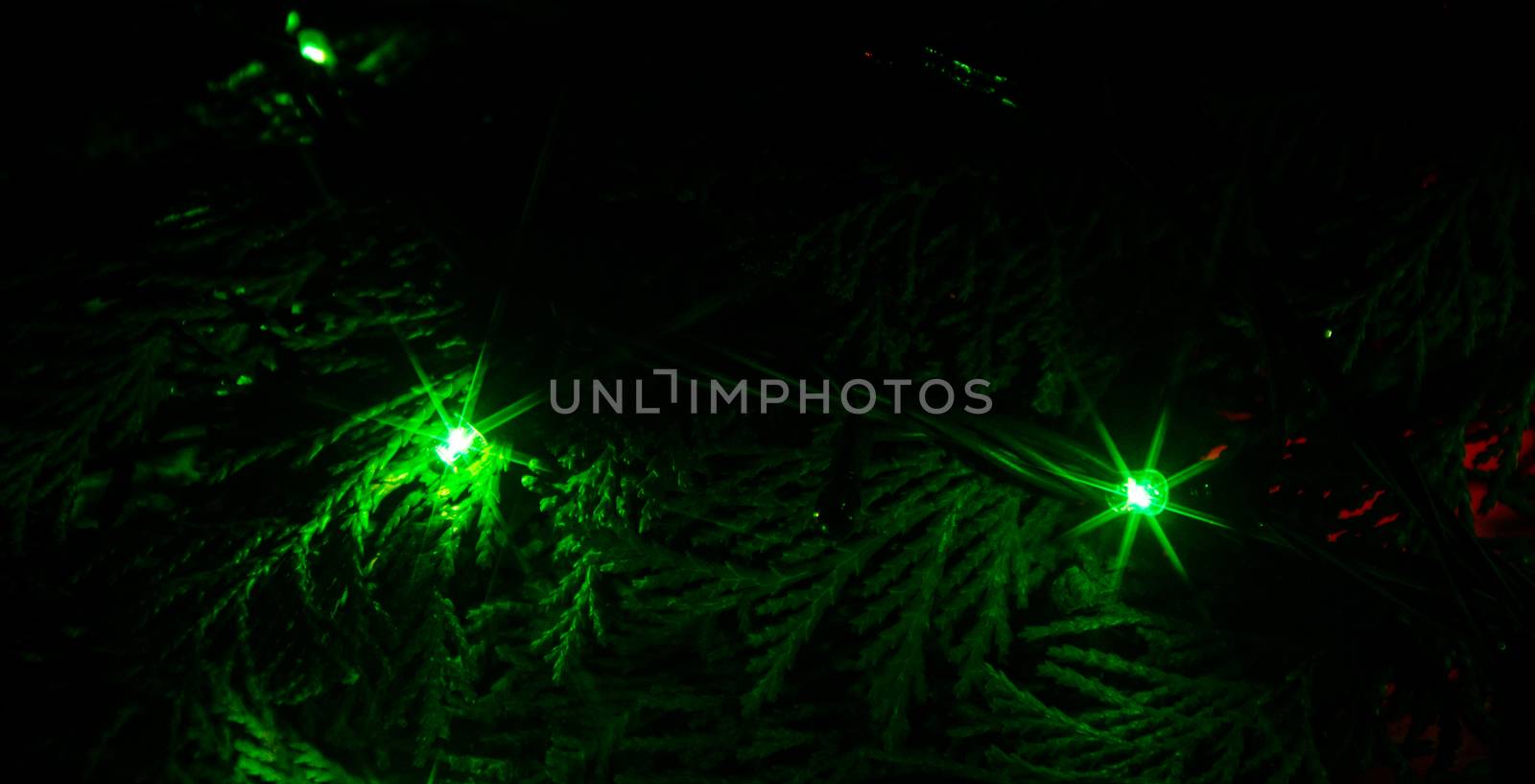 Christmas lights on a tree in different colors are classic symbol of Christmas.