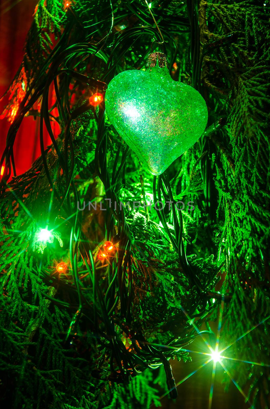 Christmas lights on a tree in different colors are classic symbol of Christmas.