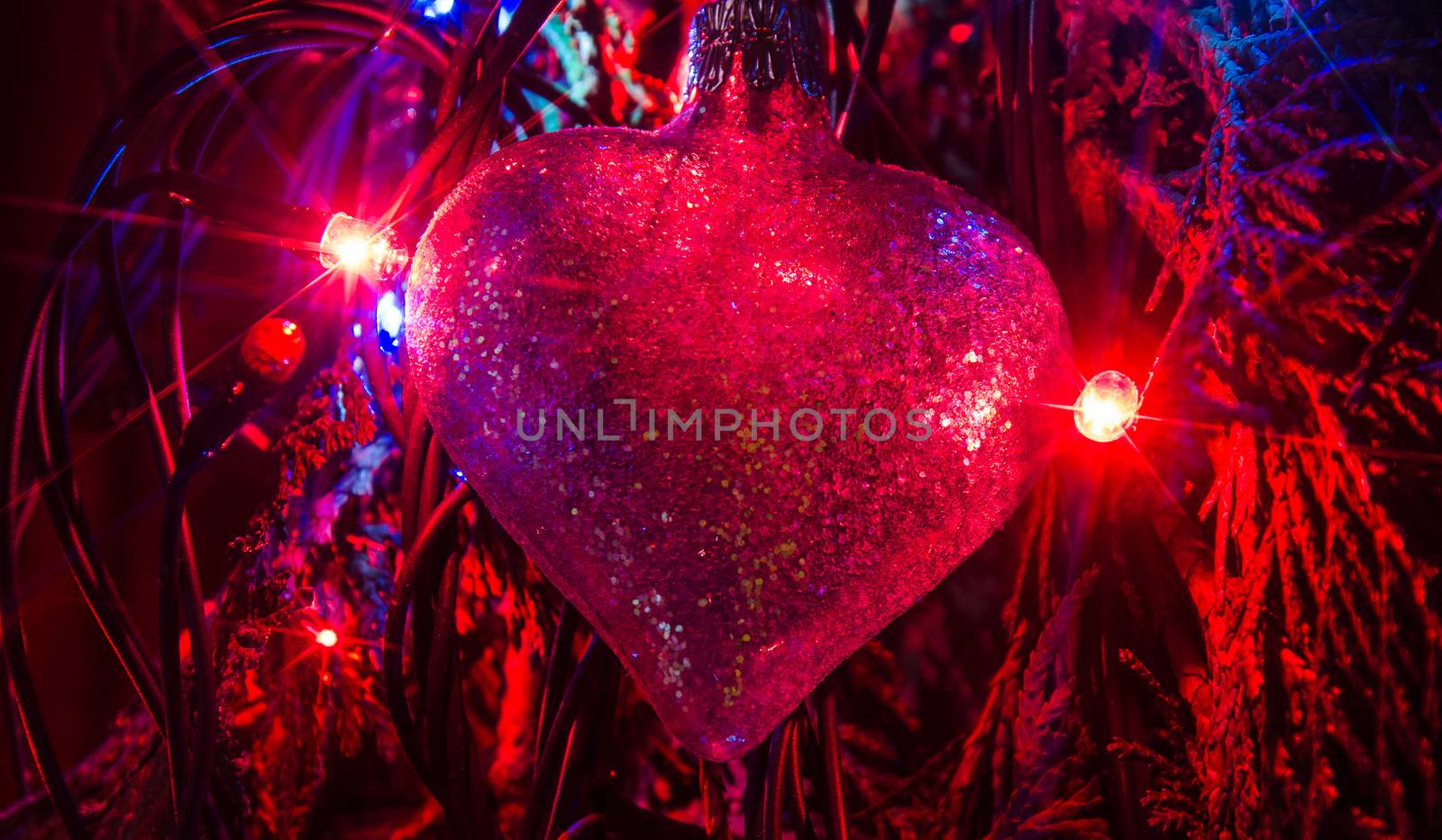 Christmas lights on a tree in different colors are classic symbol of Christmas.