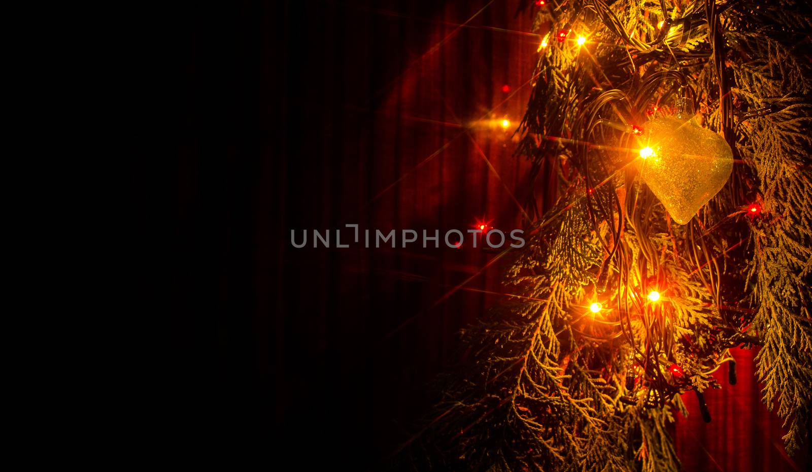 Christmas lights on a tree in different colors are classic symbol of Christmas.