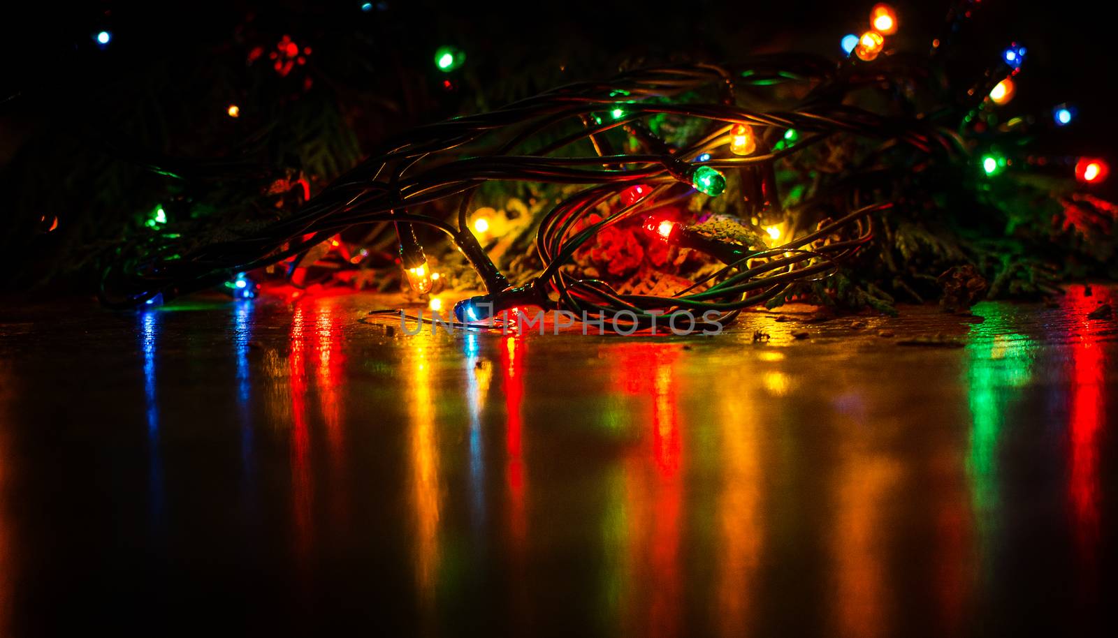Christmas lights on a tree in different colors are classic symbol of Christmas.