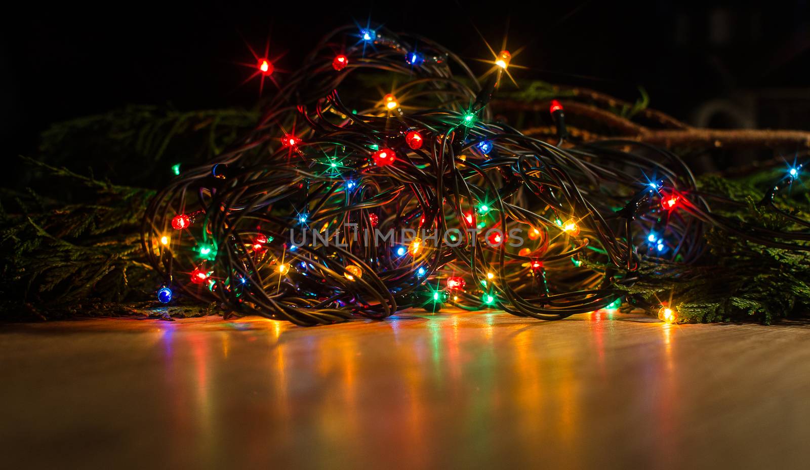 Christmas lights on a tree in different colors are classic symbol of Christmas.