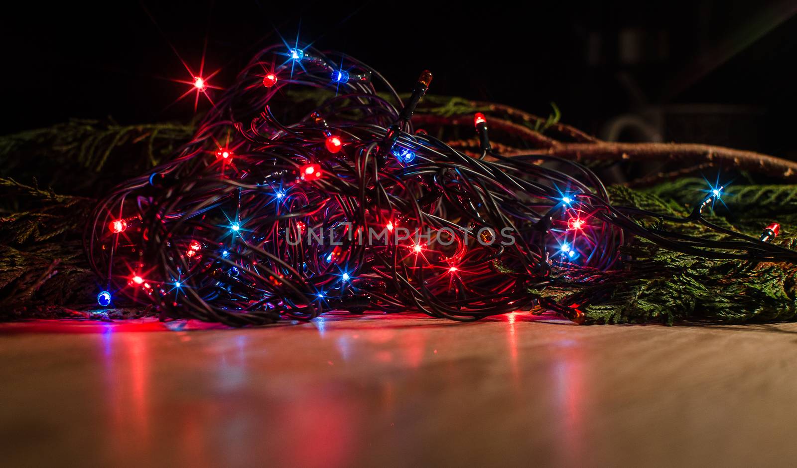 Christmas lights on a tree in different colors are classic symbol of Christmas.