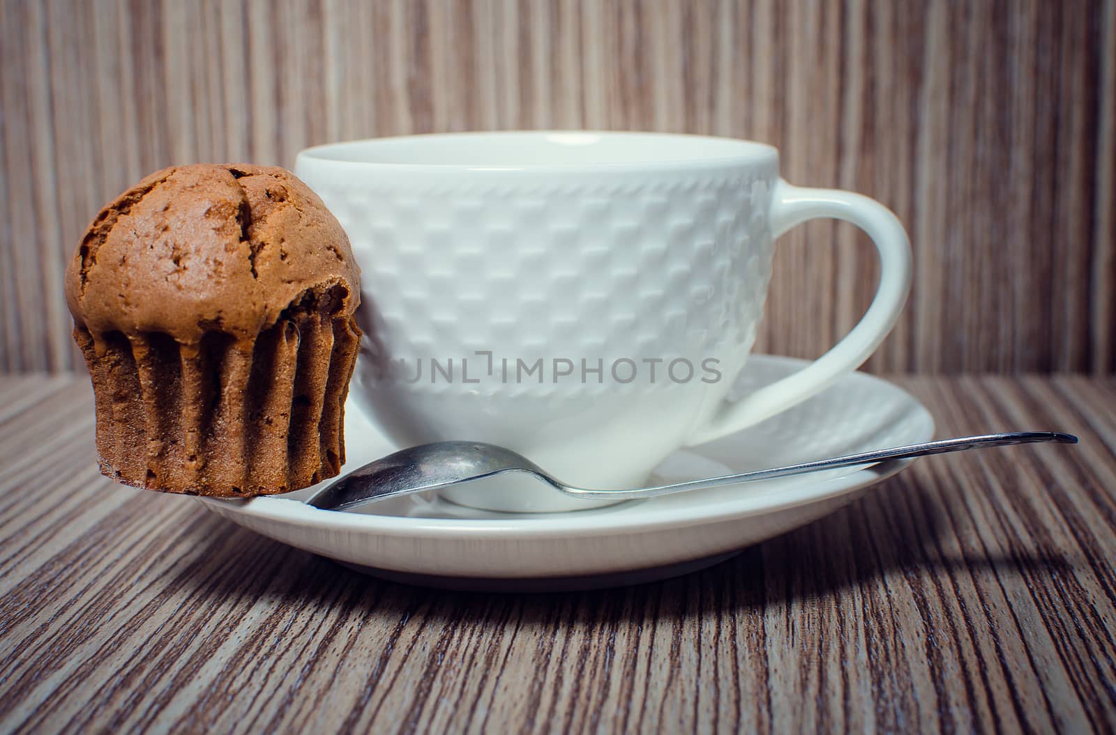 Chocolate muffin and coffee is ideal for a good breakfast.