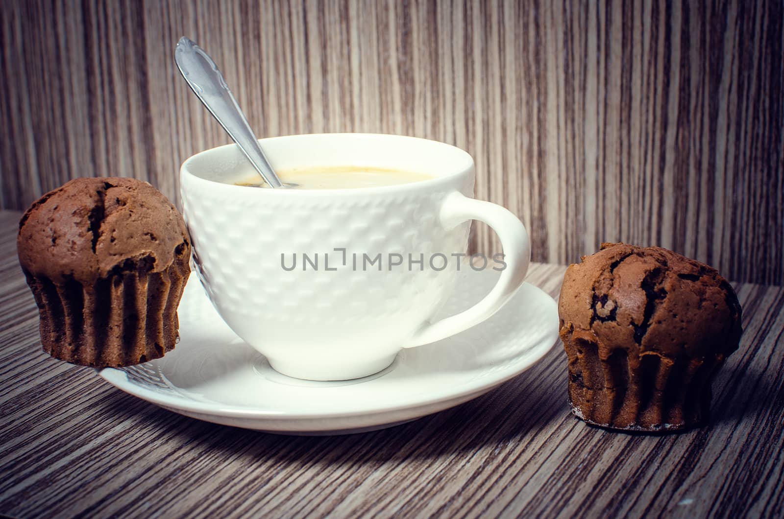 Chocolate muffin and coffee is ideal for a good breakfast.