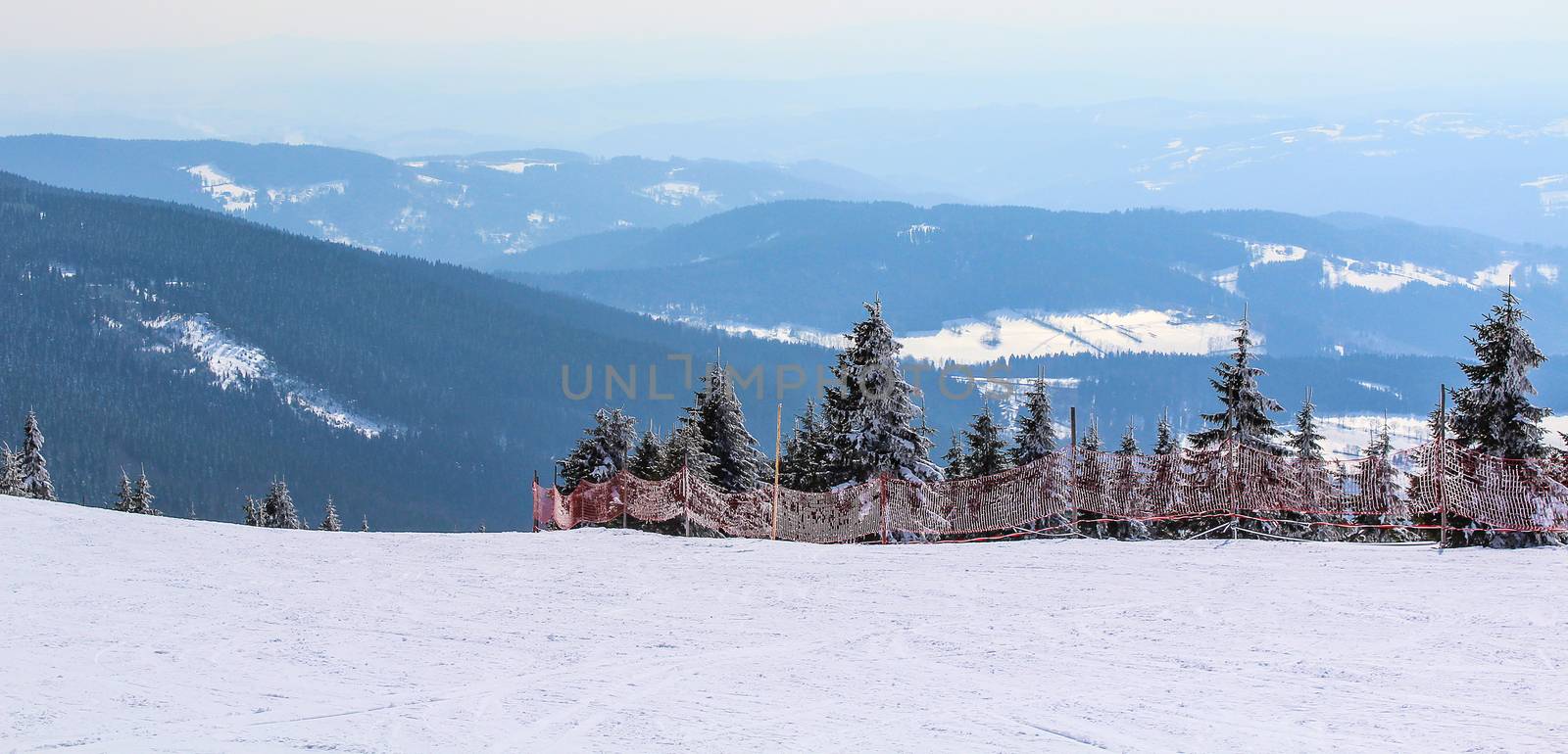 Snowy Czech mountain peak in the main ski season.