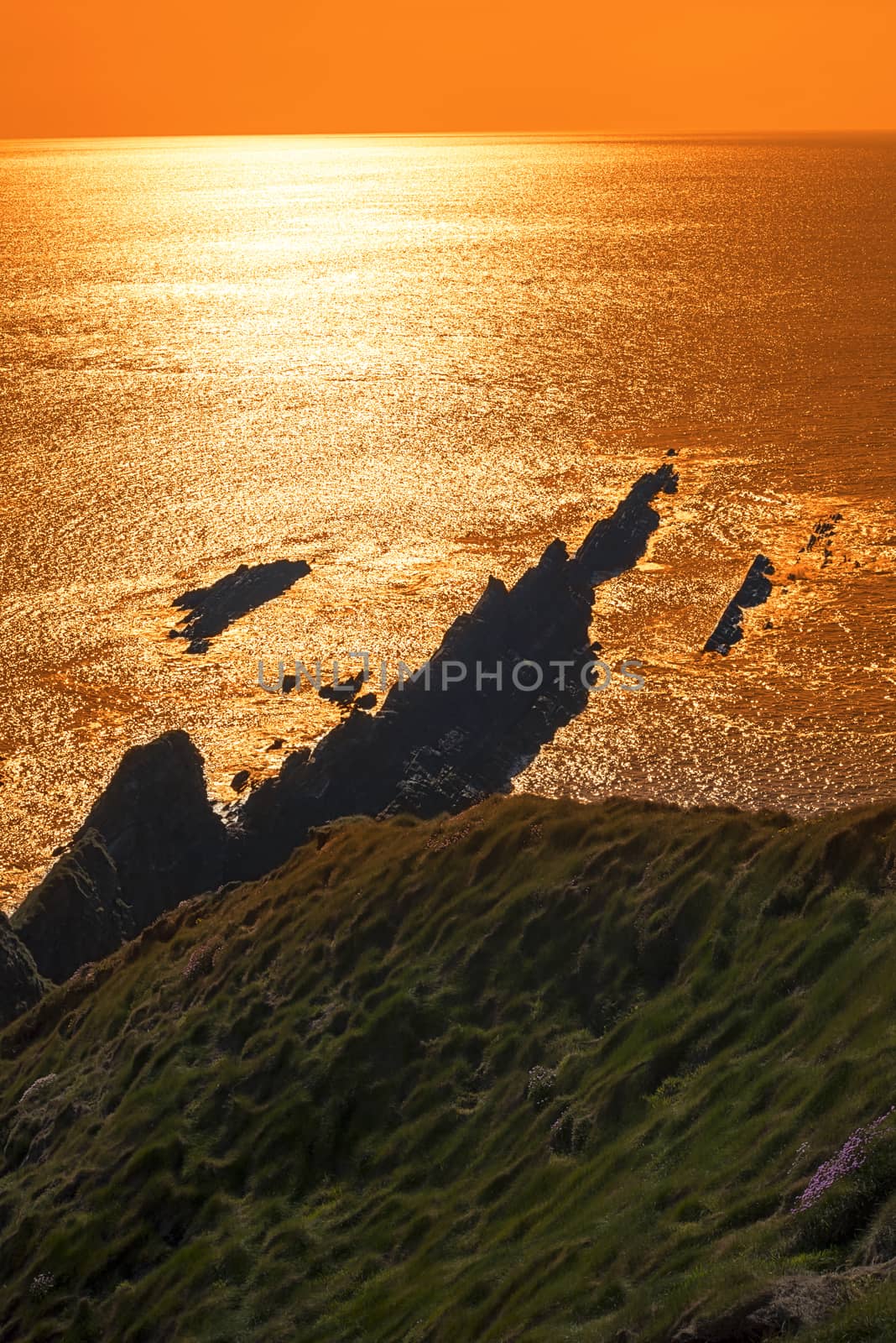 coastline and cliffs sunset in kerry by morrbyte