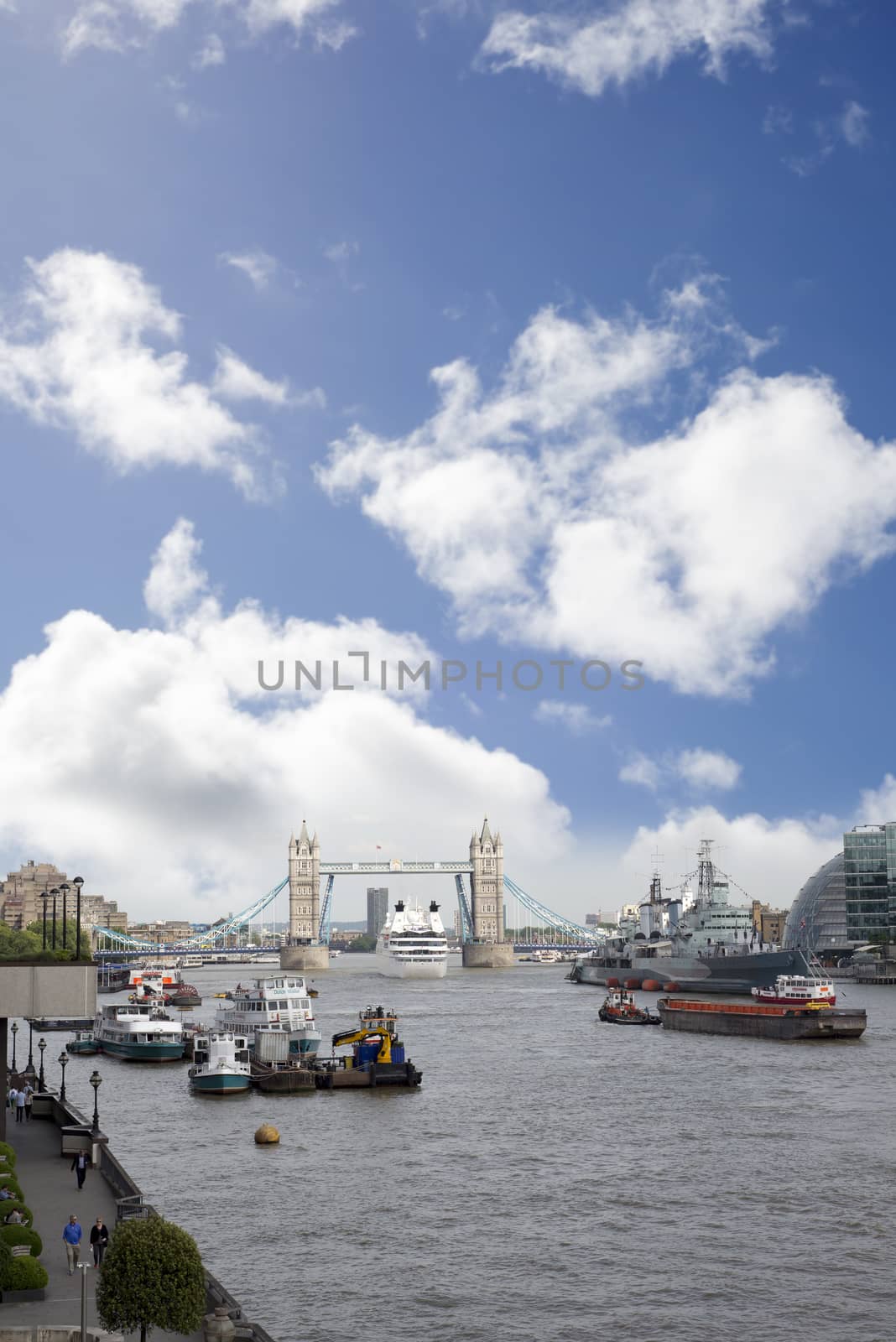 cruise liner departing london under tower bridge