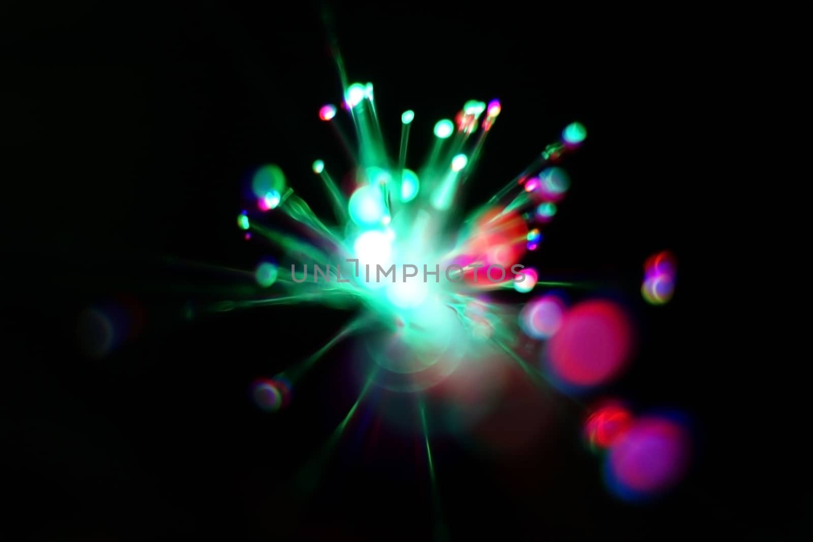 Colorful light explosion on black background. Futuristic wallpaper