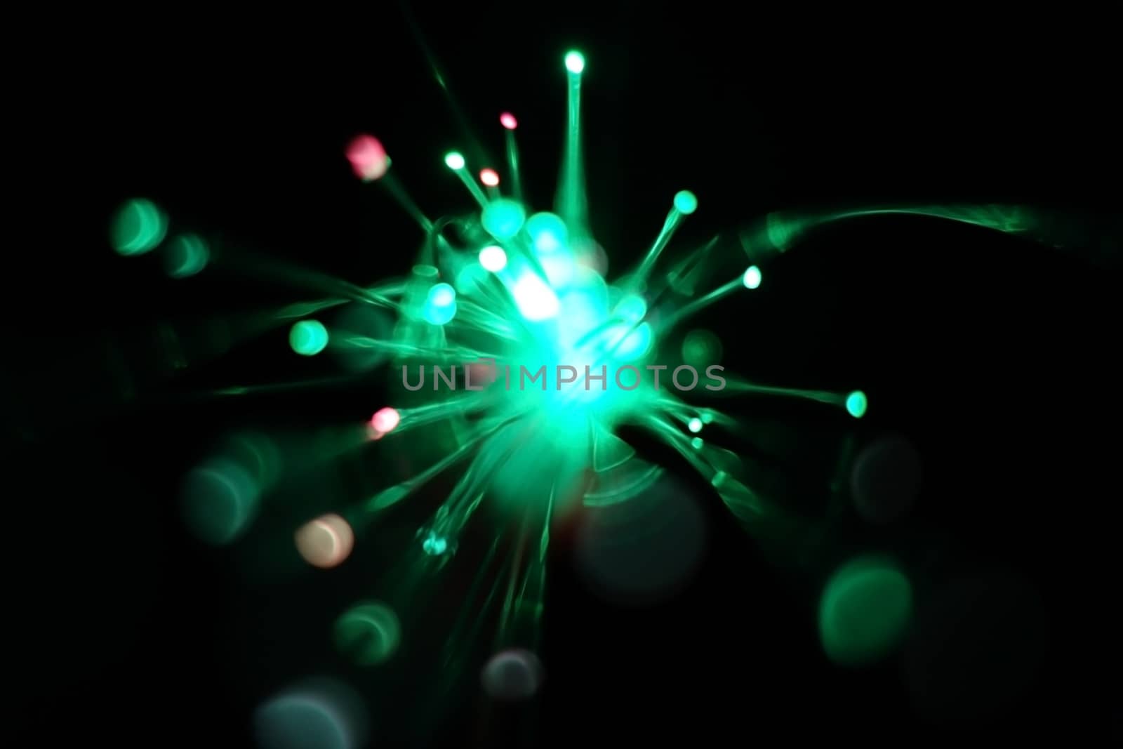 Colorful light explosion on black background. Futuristic wallpaper