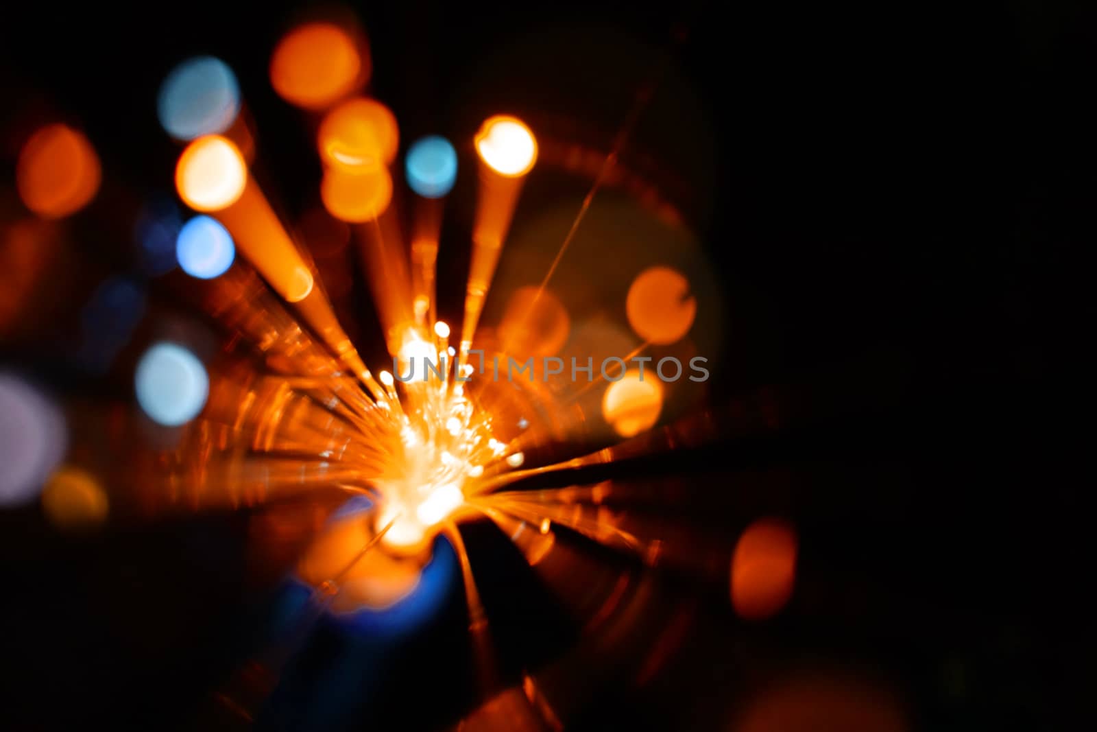 Colorful light explosion on black background. Futuristic wallpaper