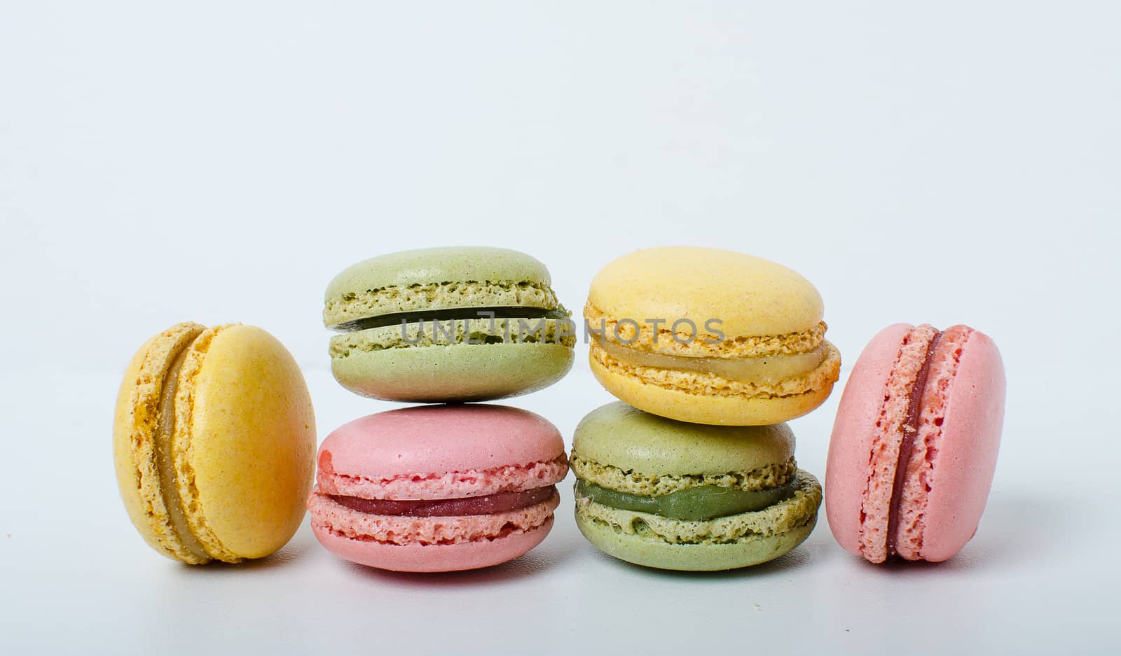 Colorful sweet macaroons on the white background.