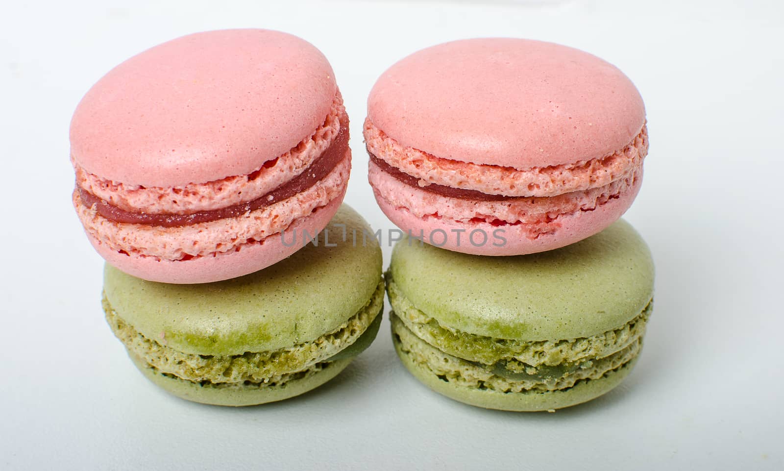 Colorful sweet macaroons on the white background.