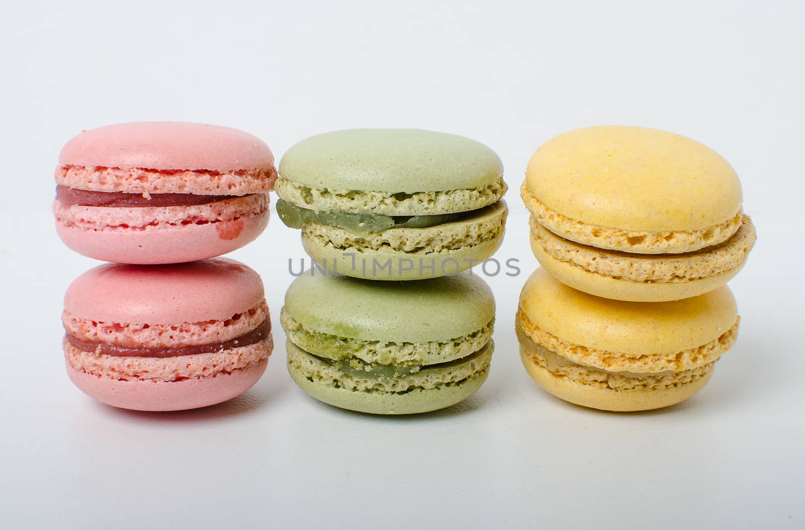 Colorful sweet macaroons on the white background.