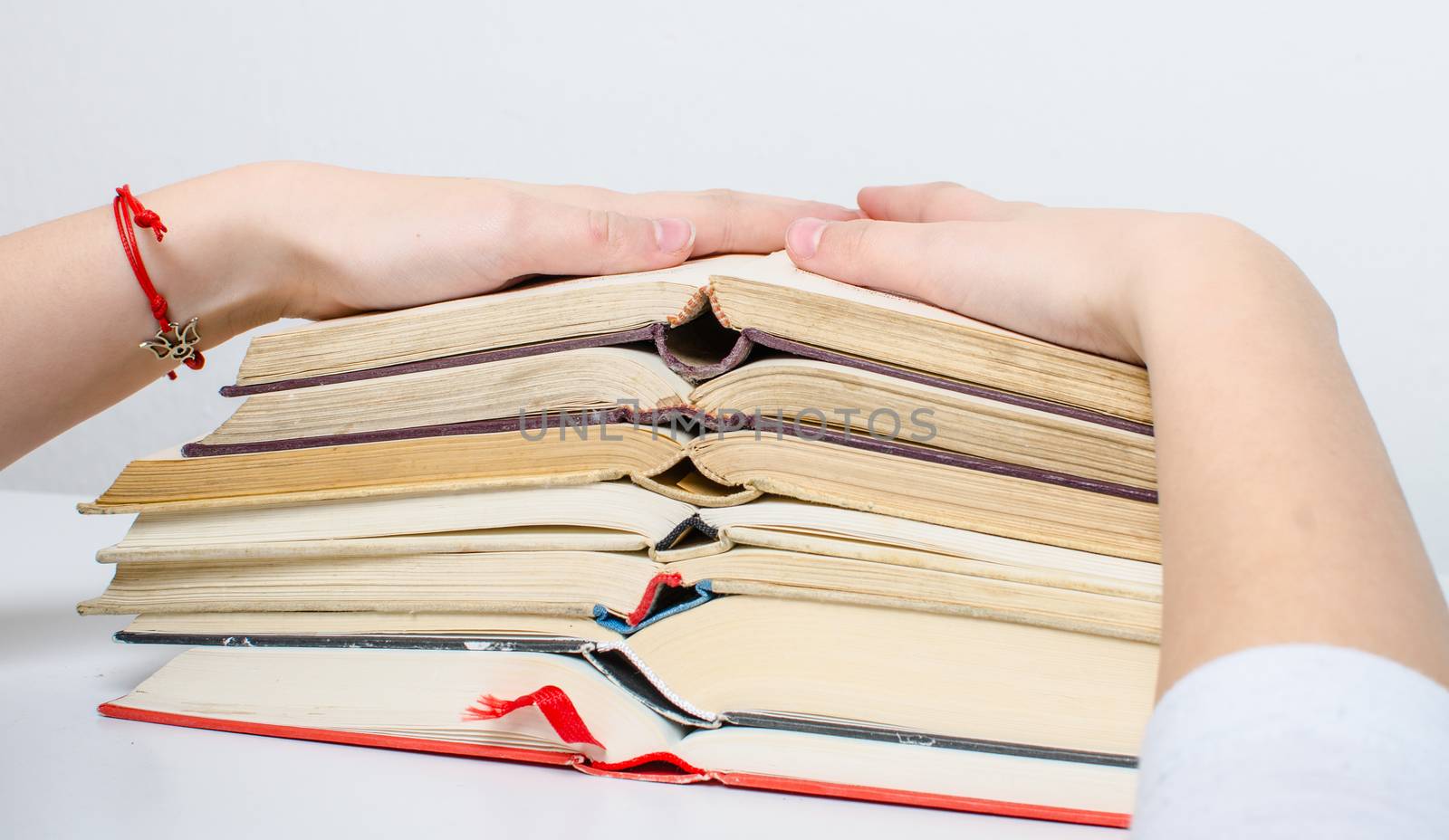 A  pile of books and a calculator help in learning.
