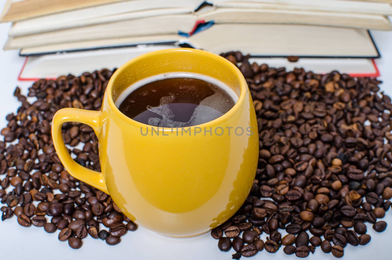A  pile of books calculator and coffee help in learning.