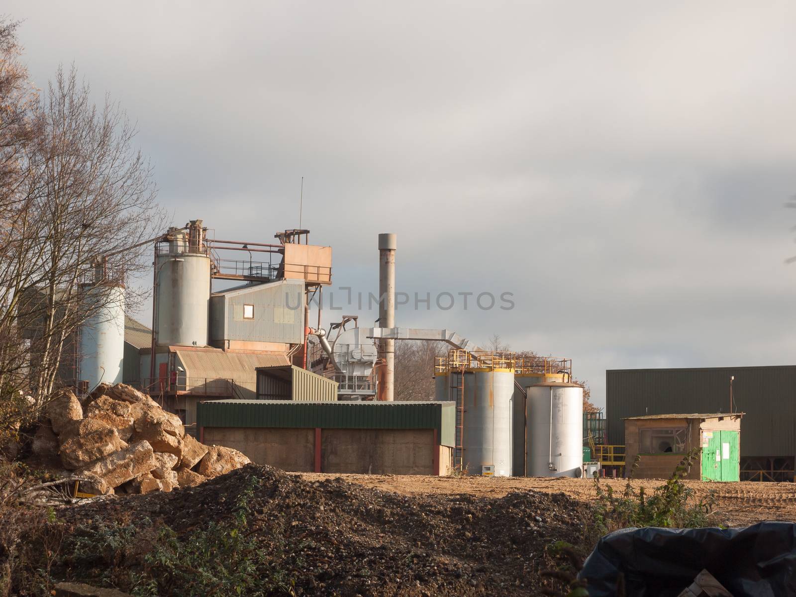 close up of factory industry buildings at sand quarry in essex w by callumrc