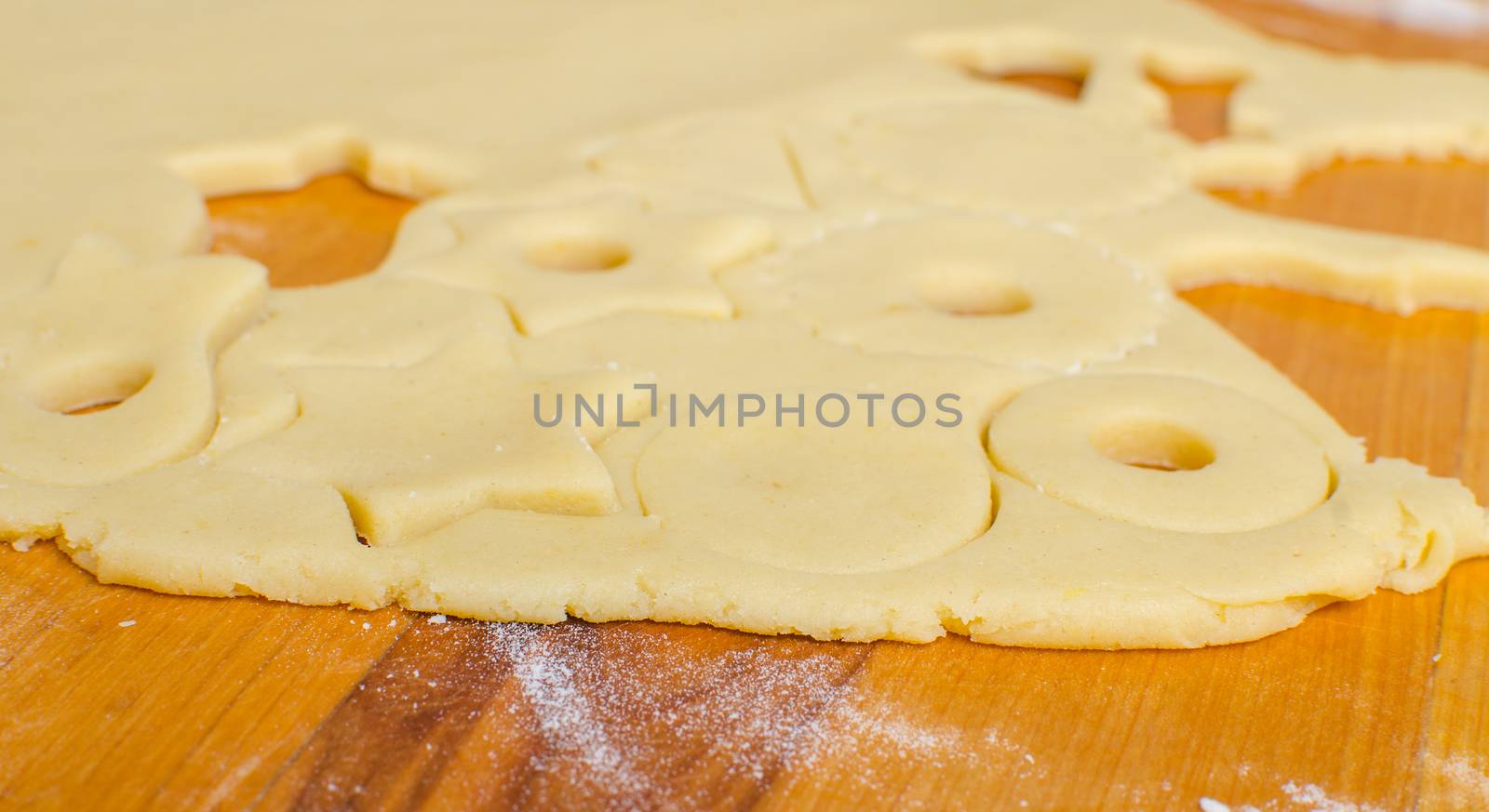 Cutting and baking Christmas cookies in Advent Time.