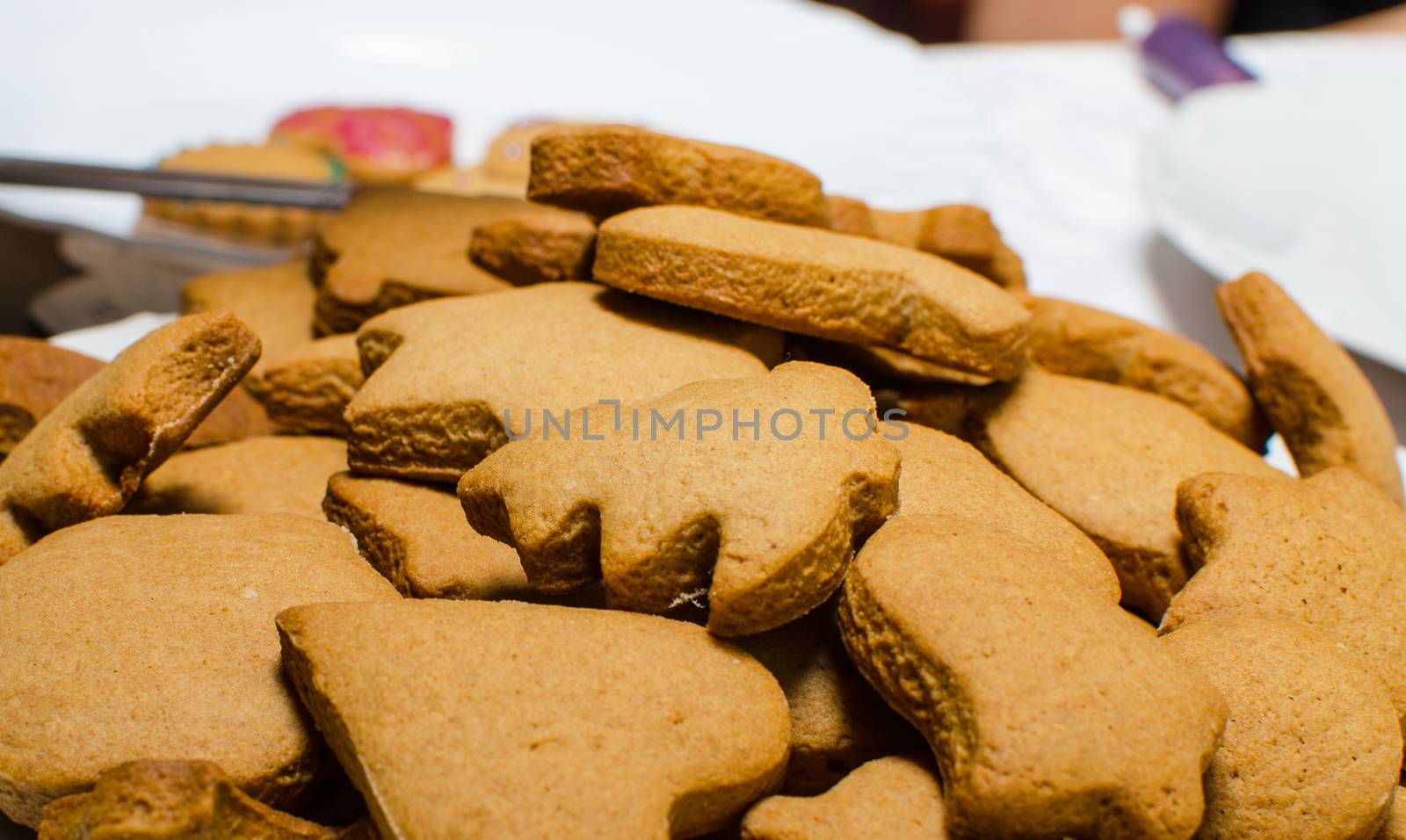 Cutting and baking Christmas gingerbread in Advent Time