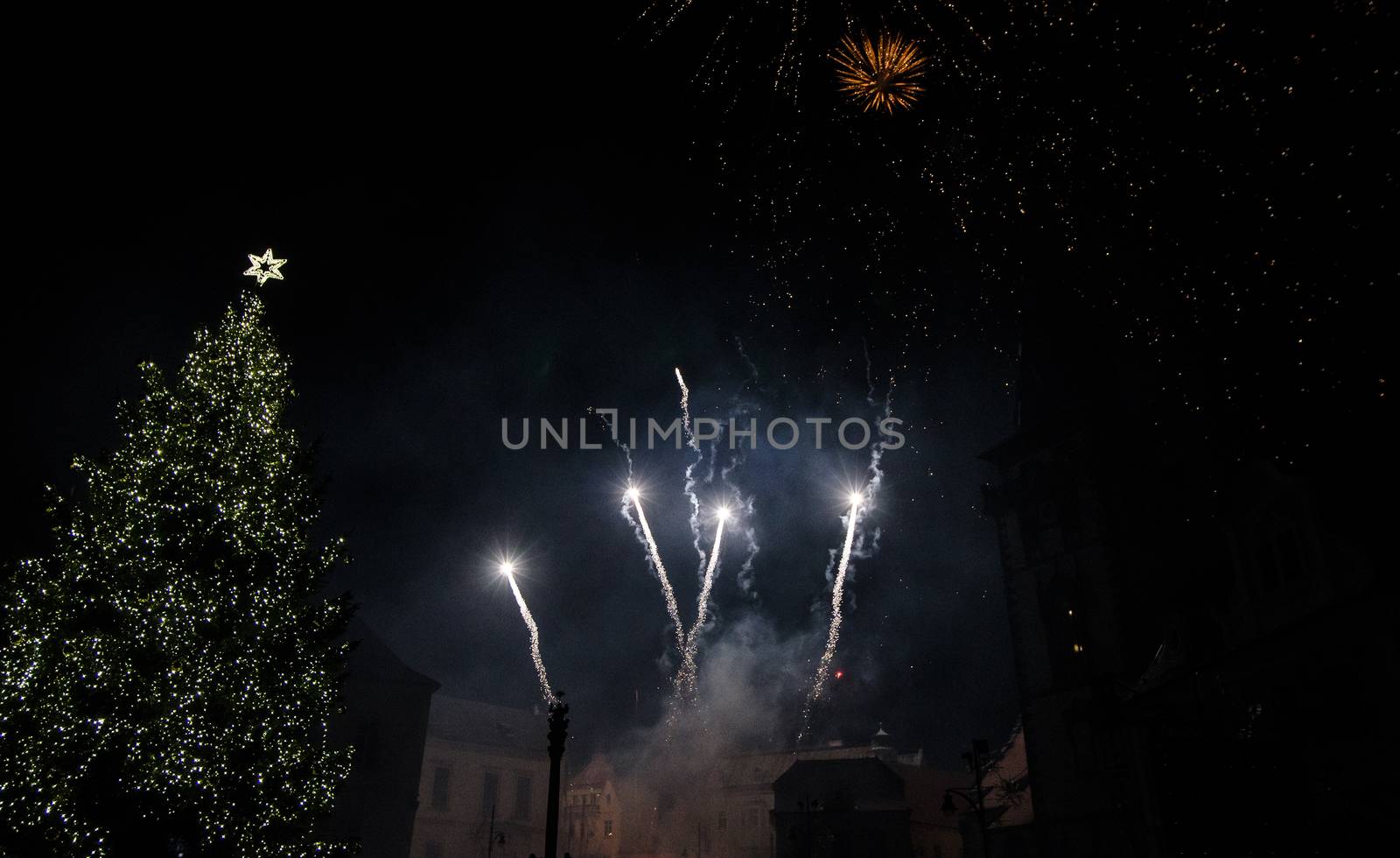 Colorful fireworks in the clouds and the beginning of Christmas time