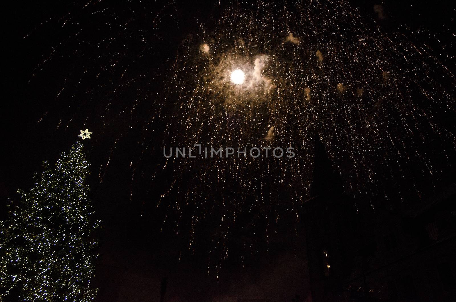 Colorful fireworks in the clouds and the beginning of Christmas time