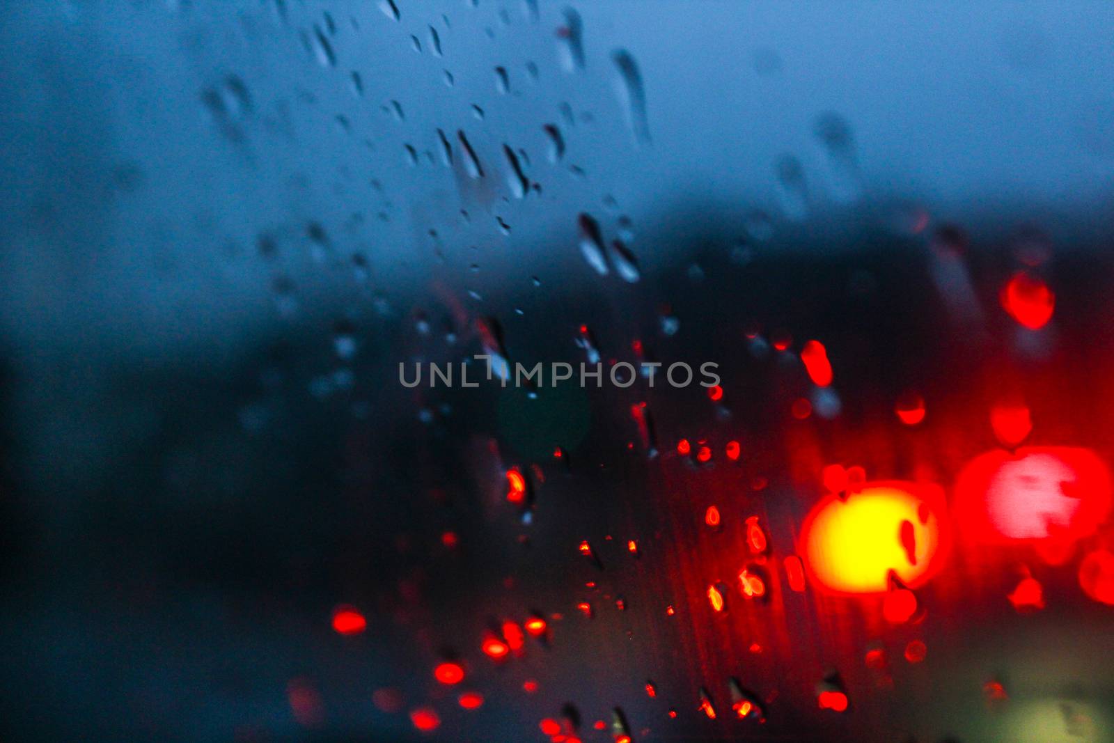 Deliberately blurred drops of water on the glass.