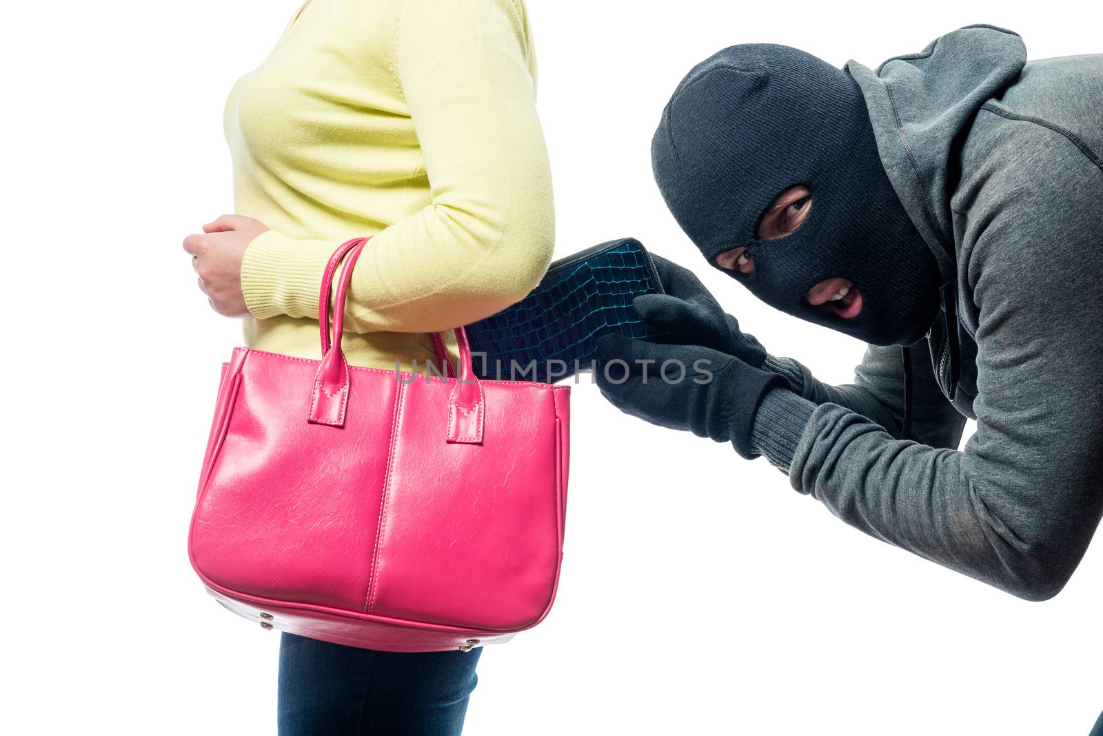 A thief pickpocket steals a purse from a women's bag in a balacl by kosmsos111