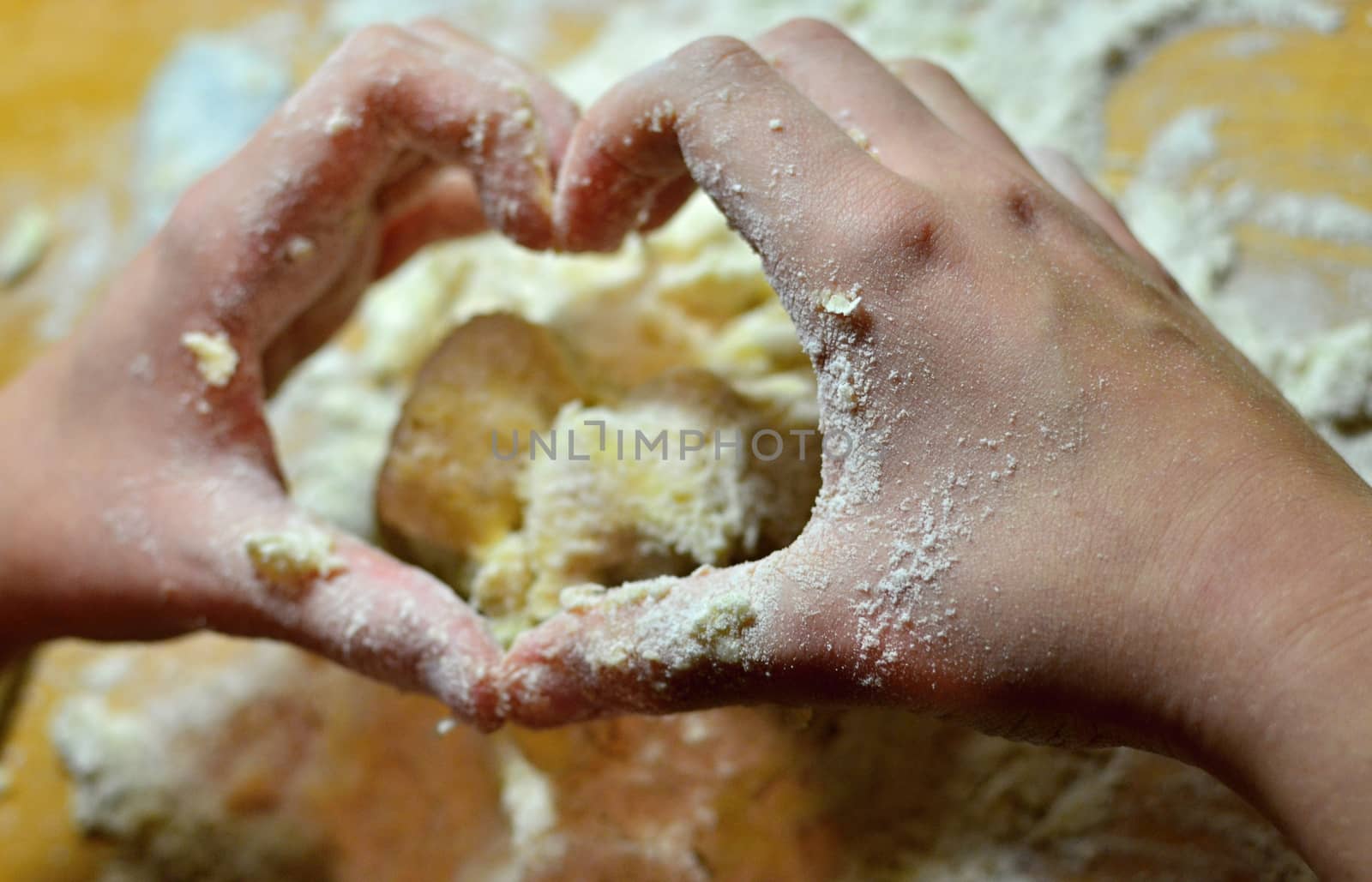 Hands baking Christmas cookies and biscuits.