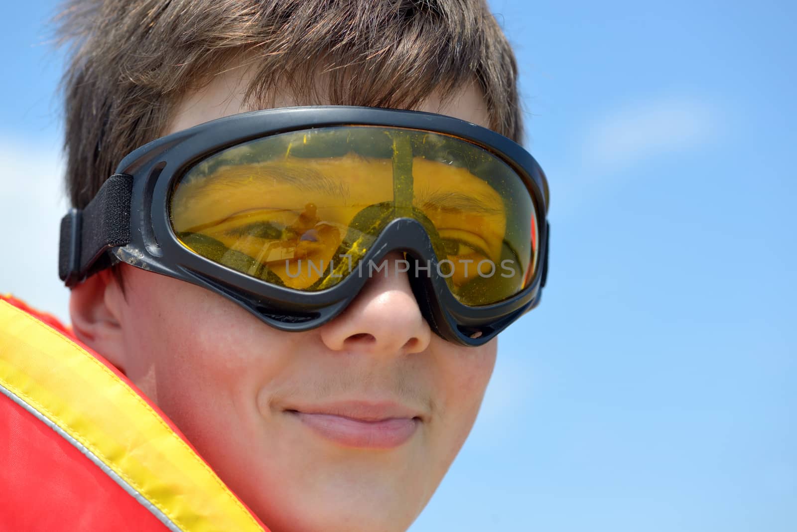 teen boy with  goggles in nature