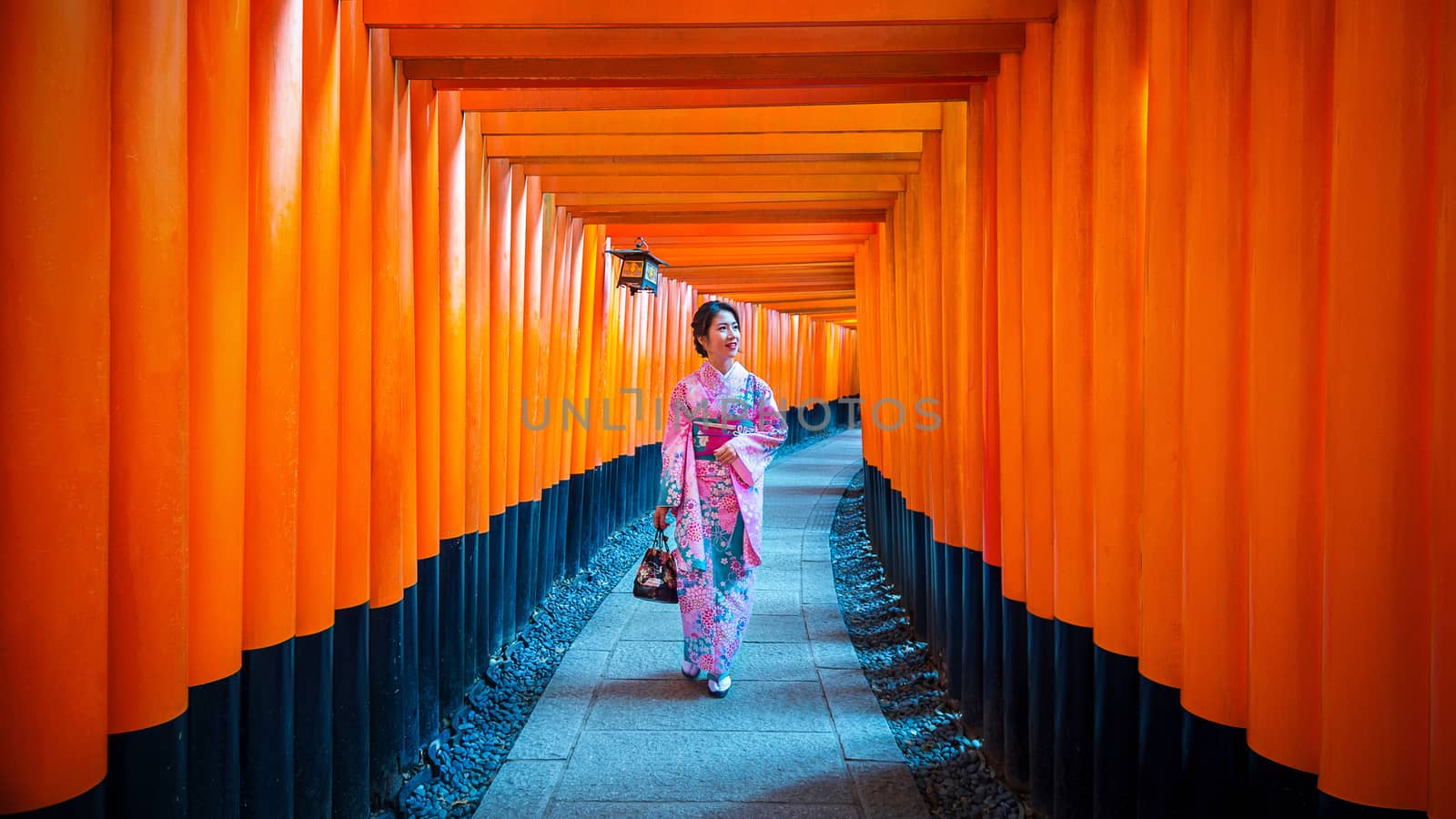 Asian women in traditional japanese kimonos at Fushimi Inari Shrine in Kyoto, Japan. by gutarphotoghaphy