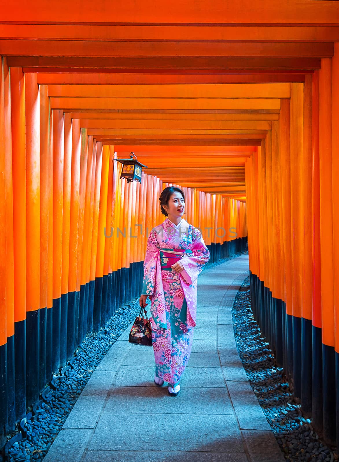 Asian women in traditional japanese kimonos at Fushimi Inari Shrine in Kyoto, Japan. by gutarphotoghaphy