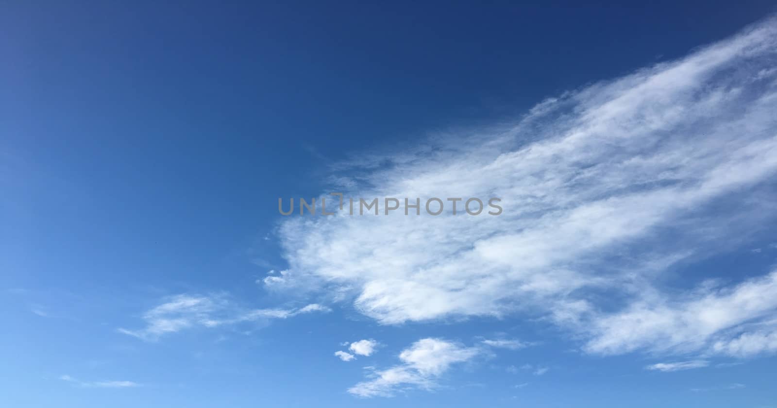 Beautiful blue sky with clouds background. Sky with clouds weather nature cloud blue. Blue sky with clouds and sun. by titco