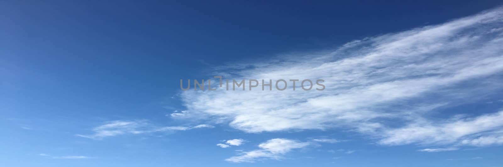 Beautiful blue sky with clouds background. Sky with clouds weather nature cloud blue. Blue sky with clouds and sun. by titco