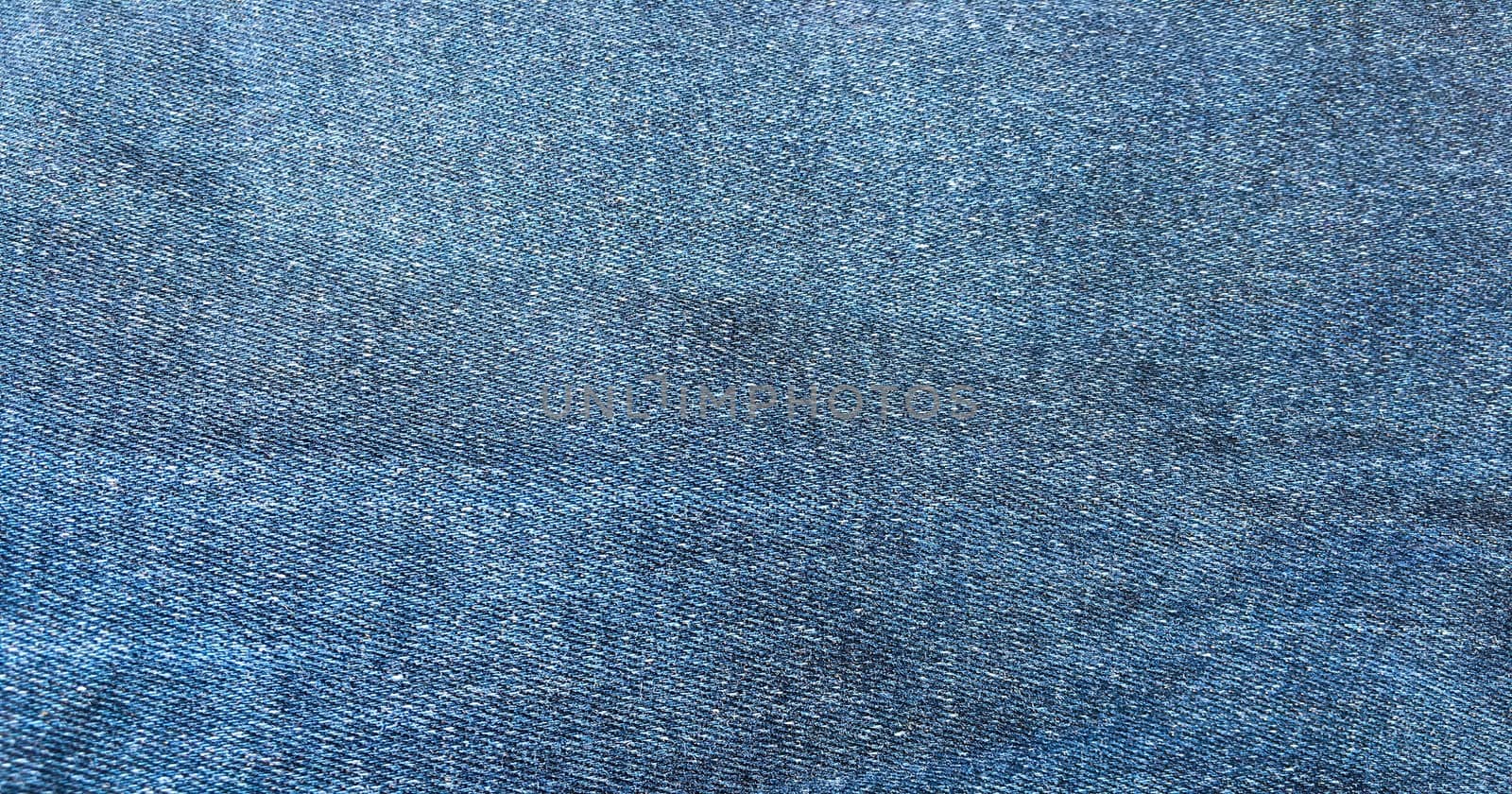 Denim jeans background, Jeans texture, denim fabric. Blue background. by titco