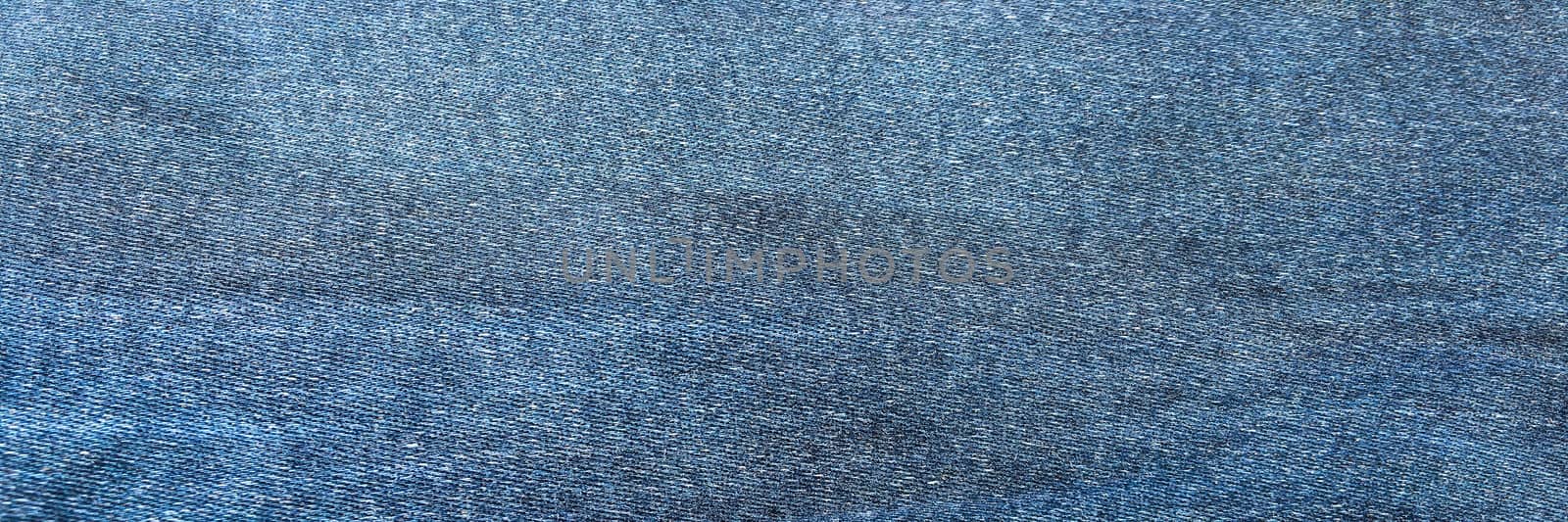 Denim jeans background, Jeans texture, denim fabric. Blue background. by titco