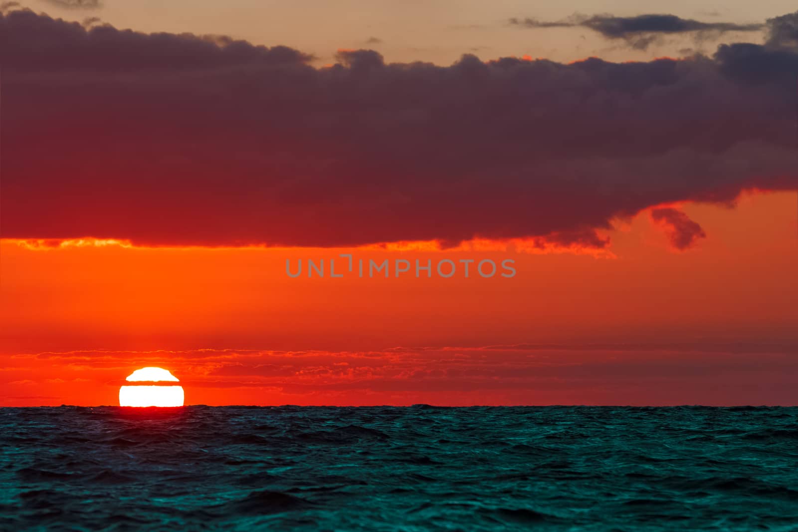 Hot and romantic sunset over the Baltic sea. Calm landscape