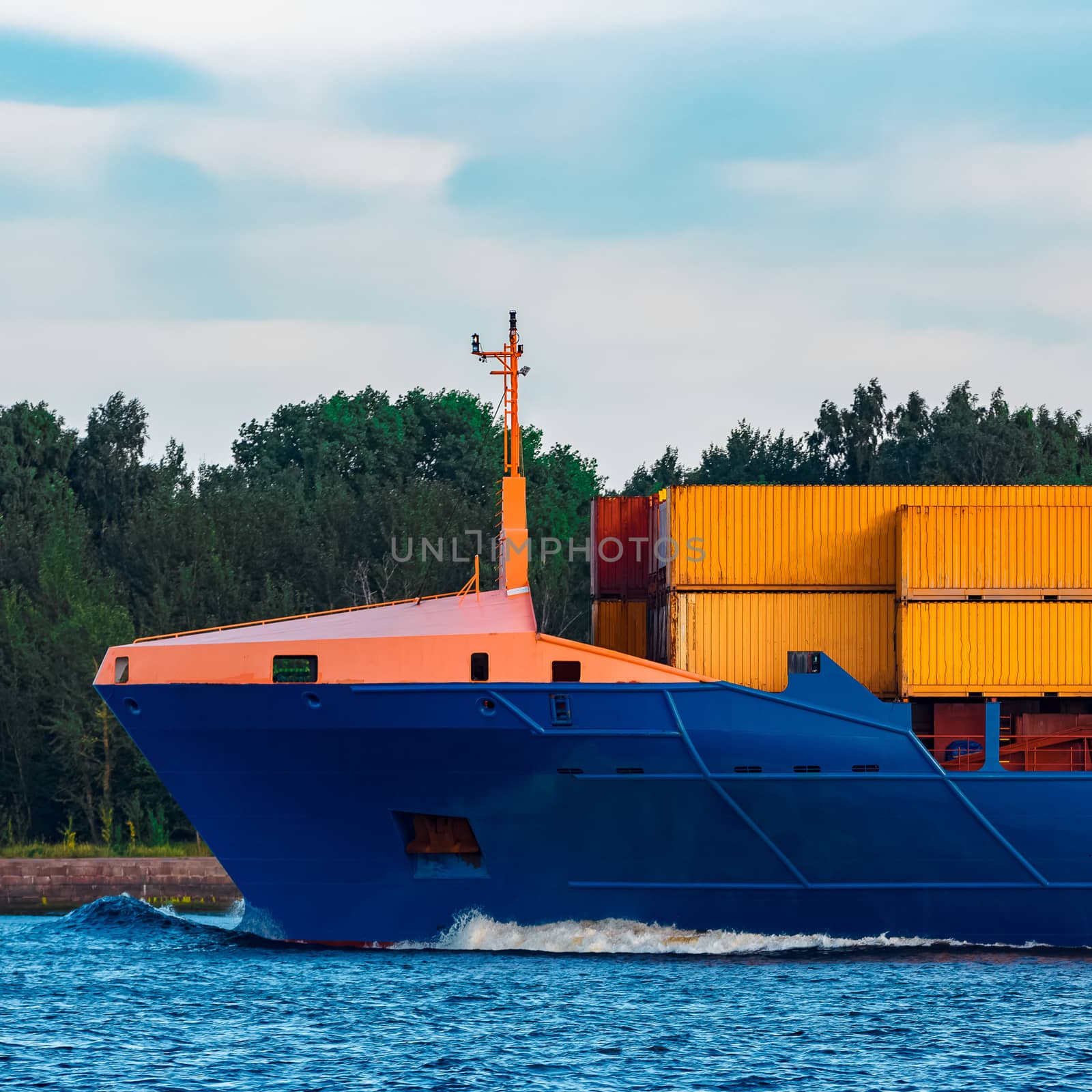 Blue container ship. Global logistics and merchandise transfer