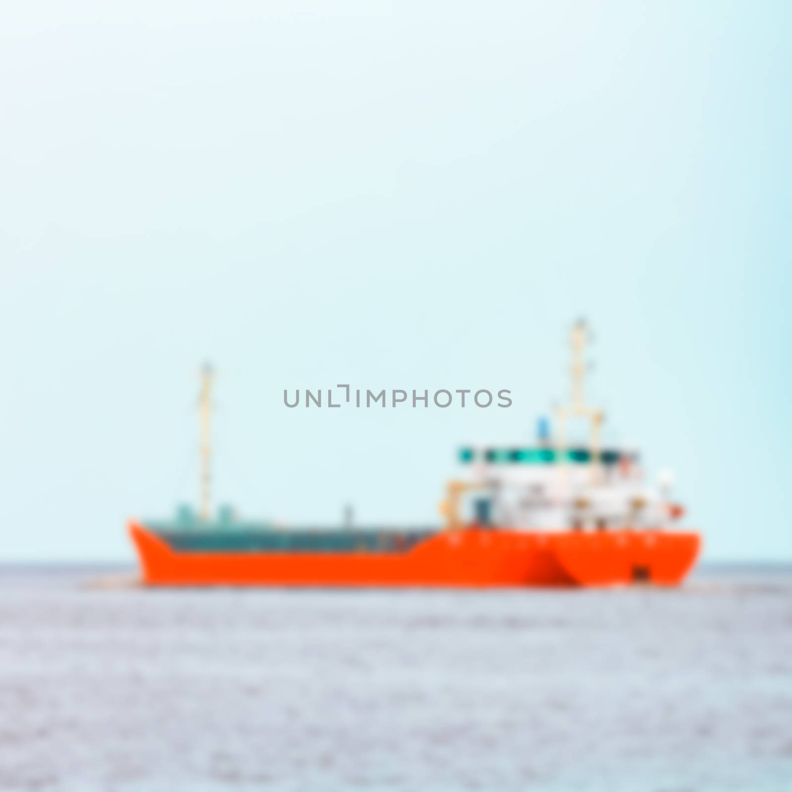 Red cargo ship - blurred image by sengnsp