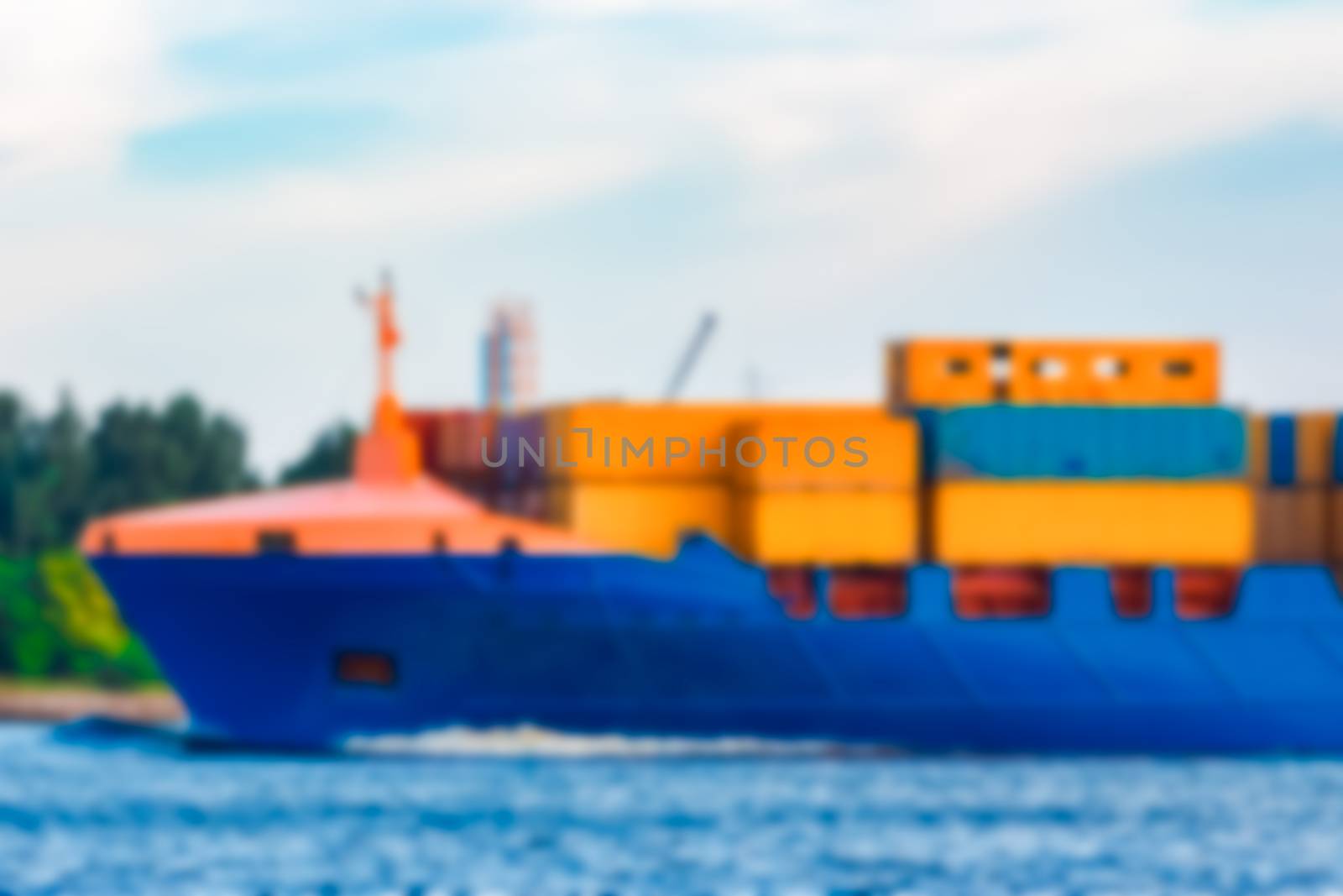 Blue cargo ship - soft lens bokeh image. Defocused background