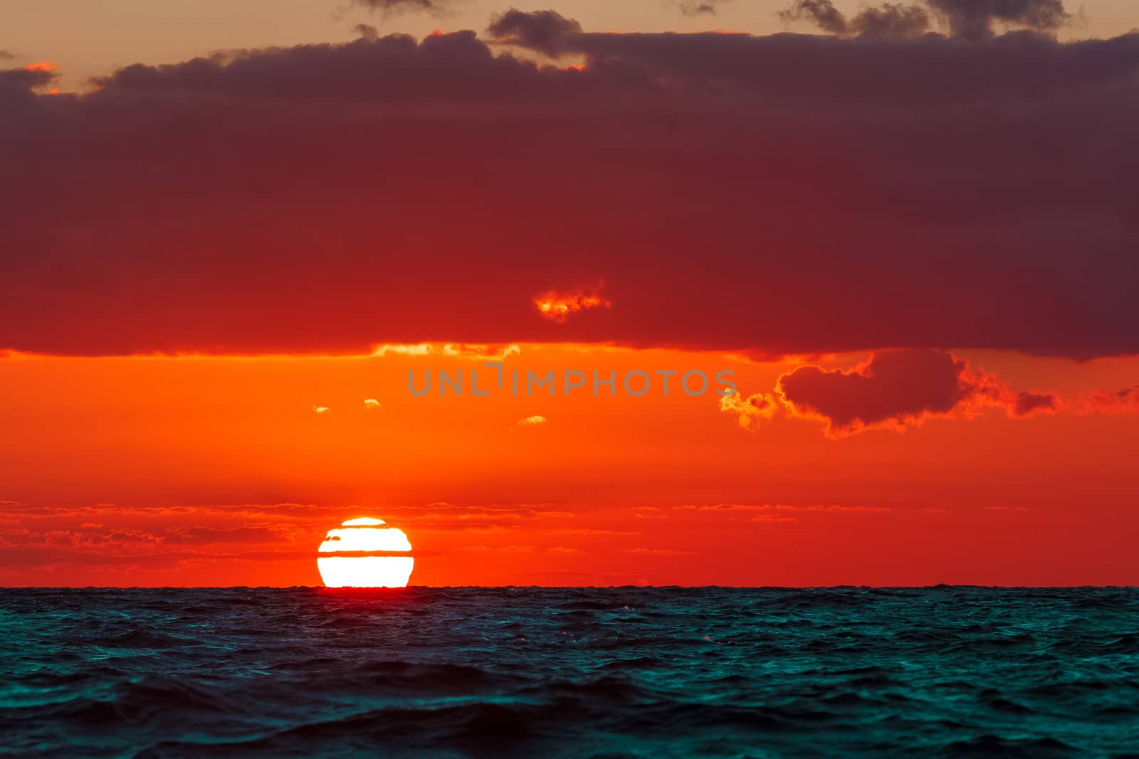 Hot and romantic sunset over the Baltic sea. Calm landscape