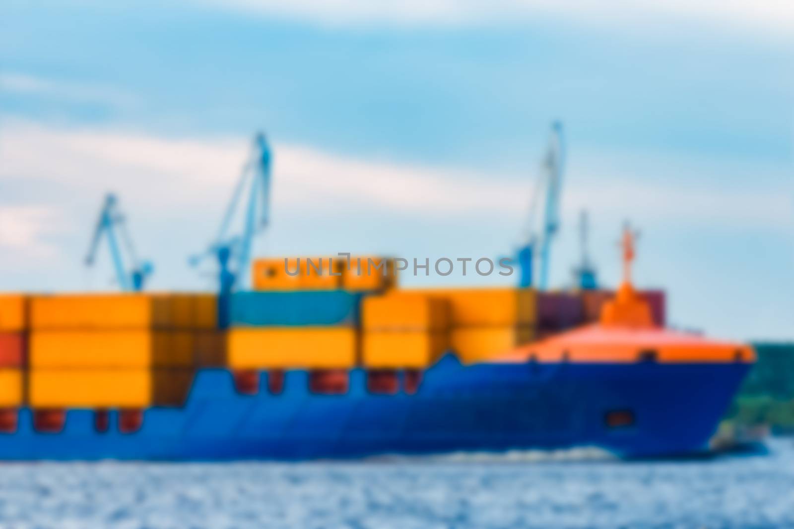 Blue cargo ship - soft lens bokeh image. Defocused background