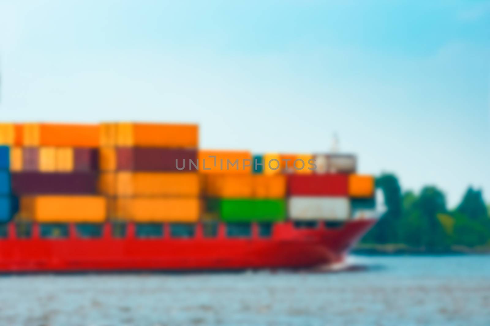 Red cargo ship - soft lens bokeh image. Defocused background