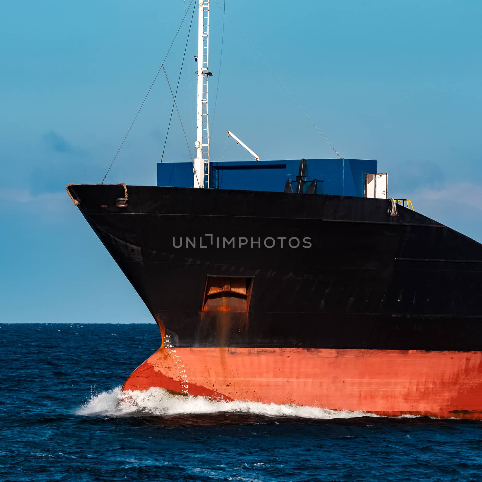 Black bulker ship. Logistics and merchandise transportations