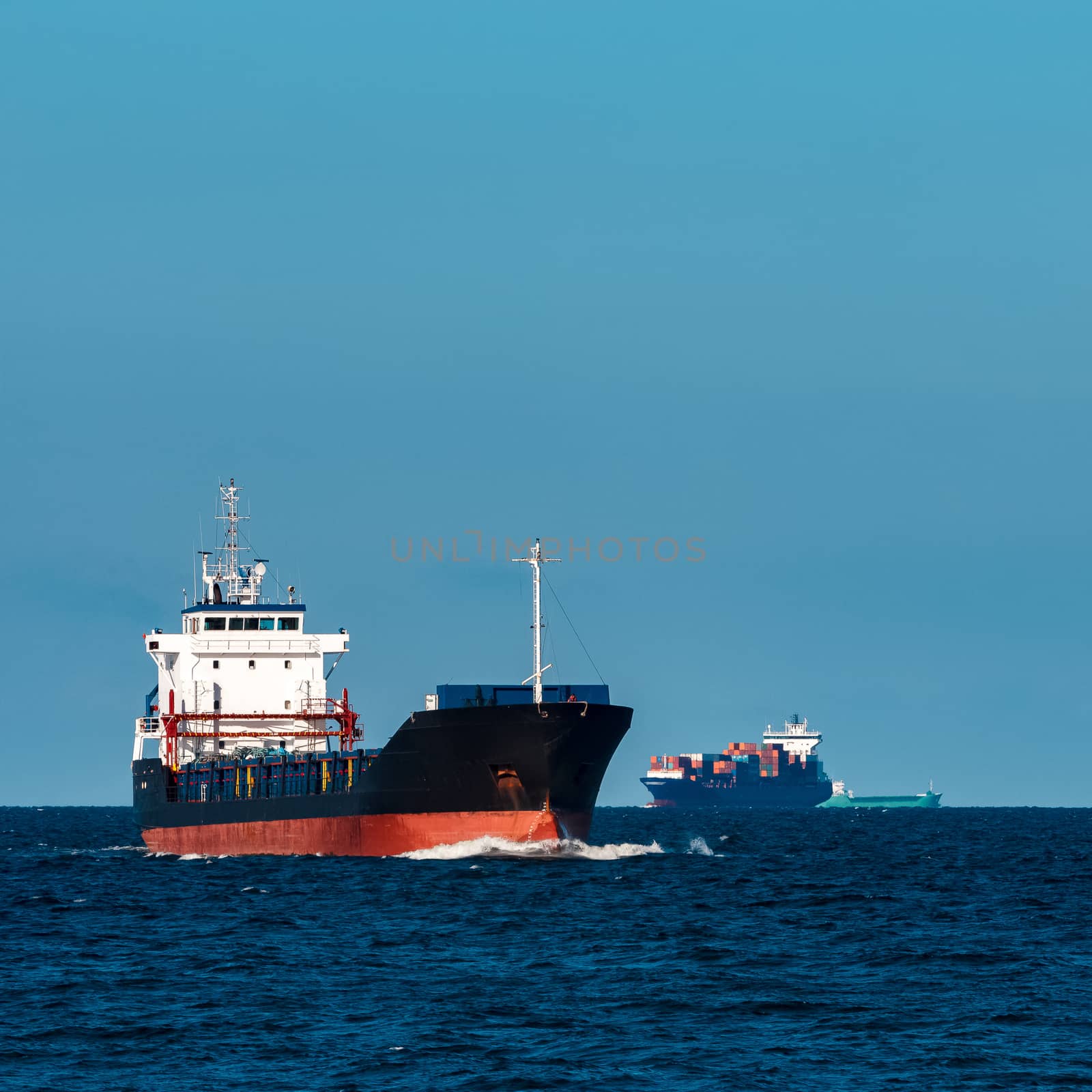 Black bulker ship. Logistics and merchandise transportations