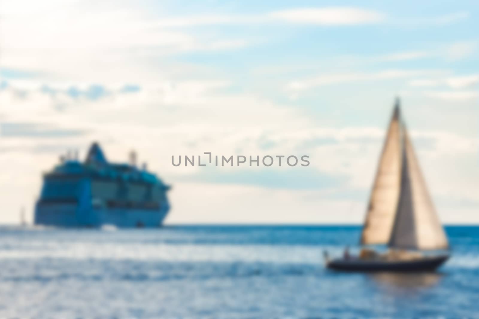 Blue sailboat - soft lens bokeh image. Defocused background